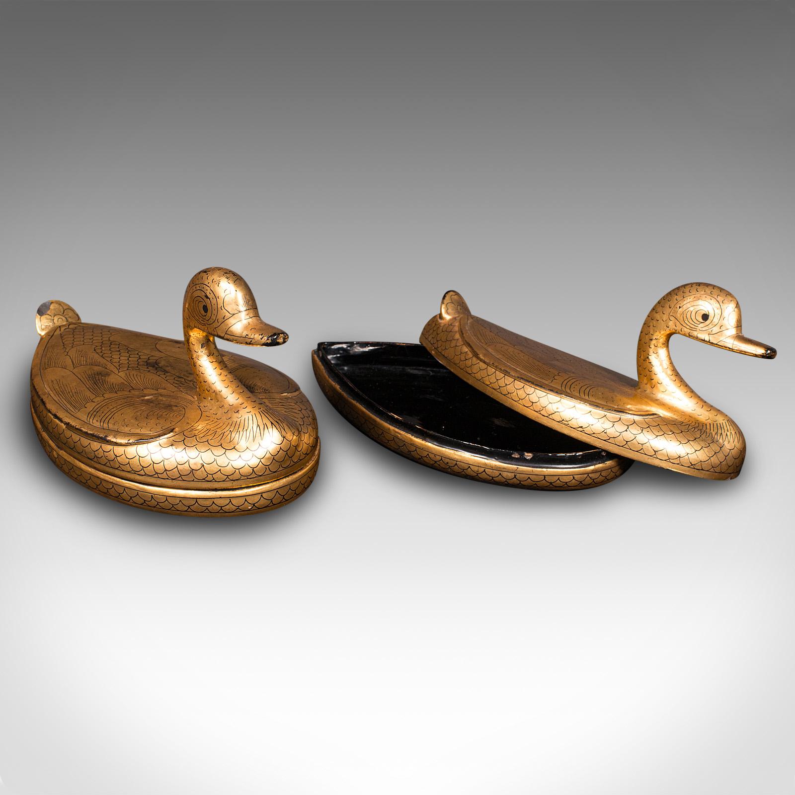 This is a pair of vintage duck form pots. An Oriental, lacquer and gilt decorative trinket box, dating to the Art Deco period, circa 1940.

Of delightful duck form, with small trays for keeping trinkets
Displaying a desirable aged patina and in good