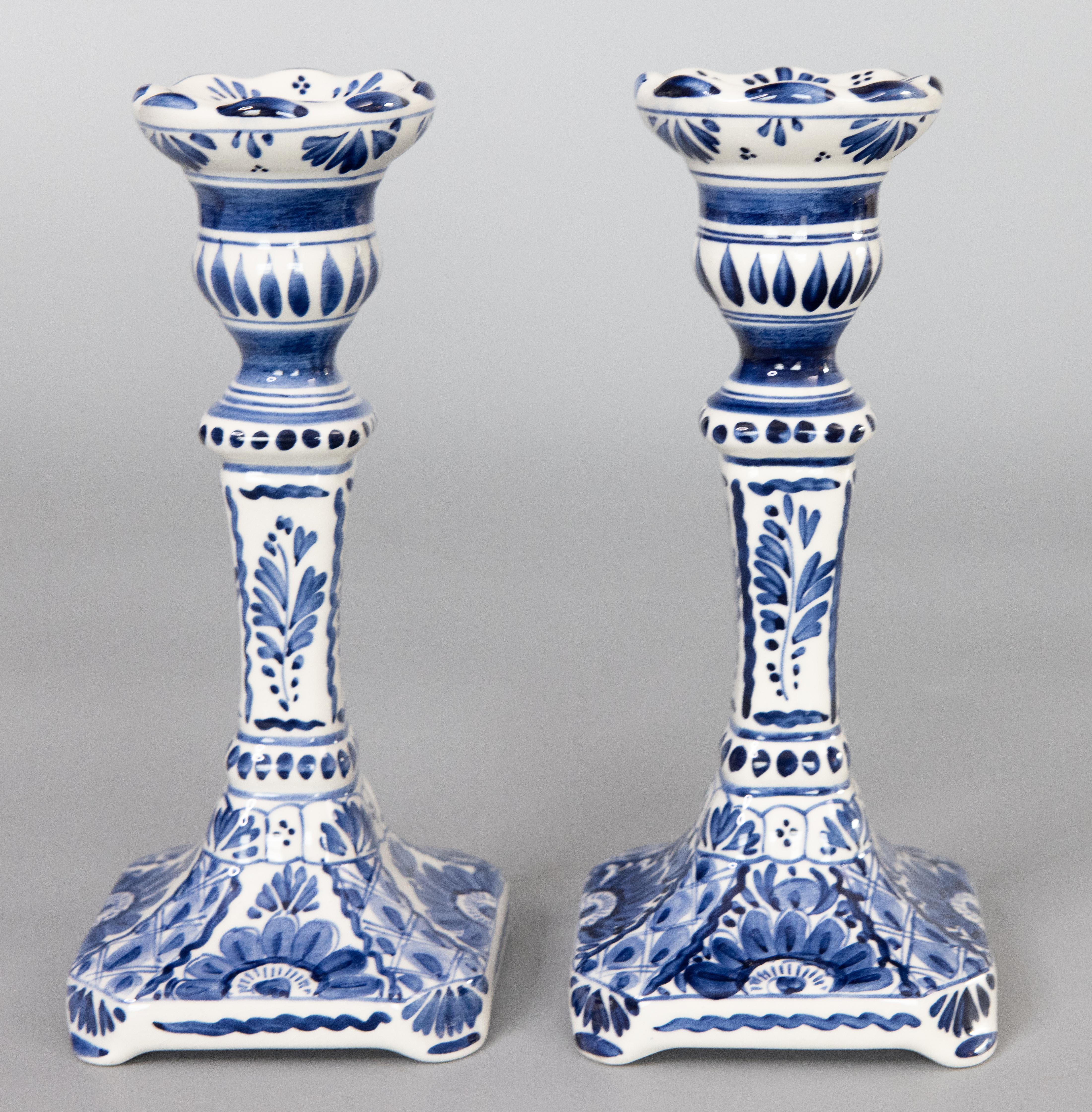 A lovely pair of Mid-Century Dutch Delft faience candlesticks. These fine candlesticks are hand painted with a floral design in the traditional Delft colors of cobalt blue and white.

Dimensions
3.5