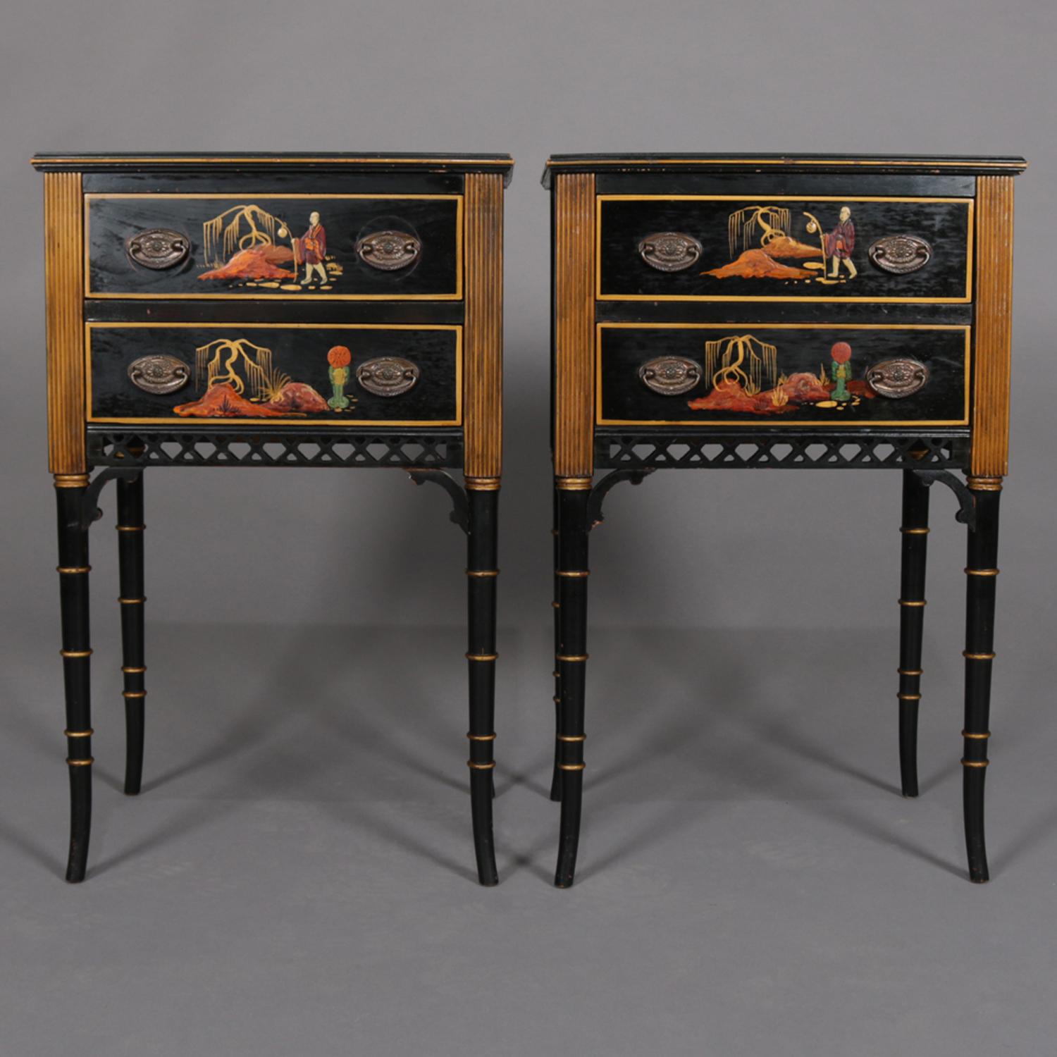 A pair of Chinoiserie decorated end stands feature ebonized cabinets each having two drawers with hand painted scenes including figures in countryside setting surmounting cut-out lattice skirt and raised on stylized bamboo form legs, gilt banding