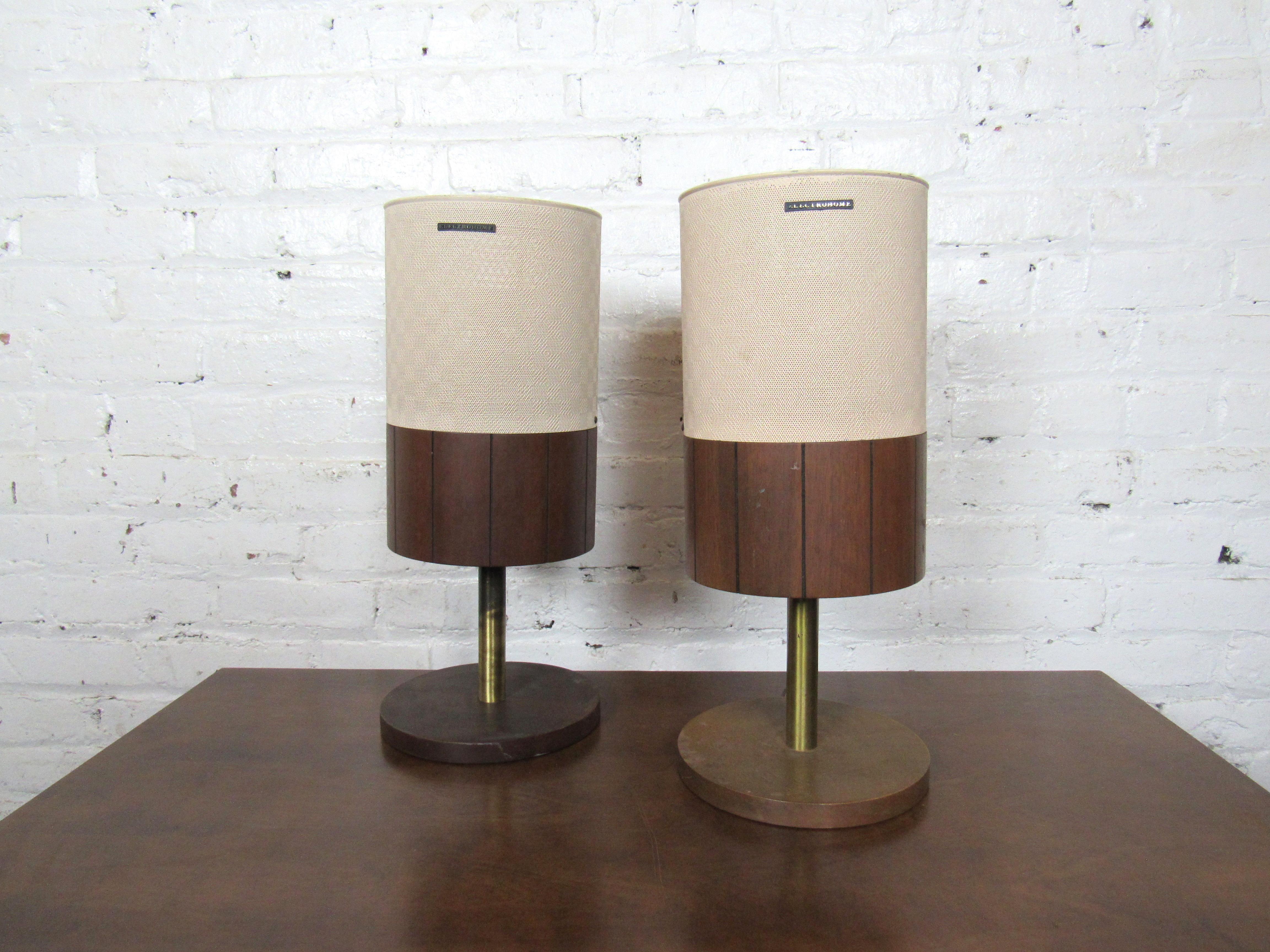 A pair of vintage midcentury speakers for connection to record players or other devices. With a base of brass and walnut, these speakers add authenticity to any vintage record player setup. Made by Dominion Electrohome Industries Ltd. Canada.
