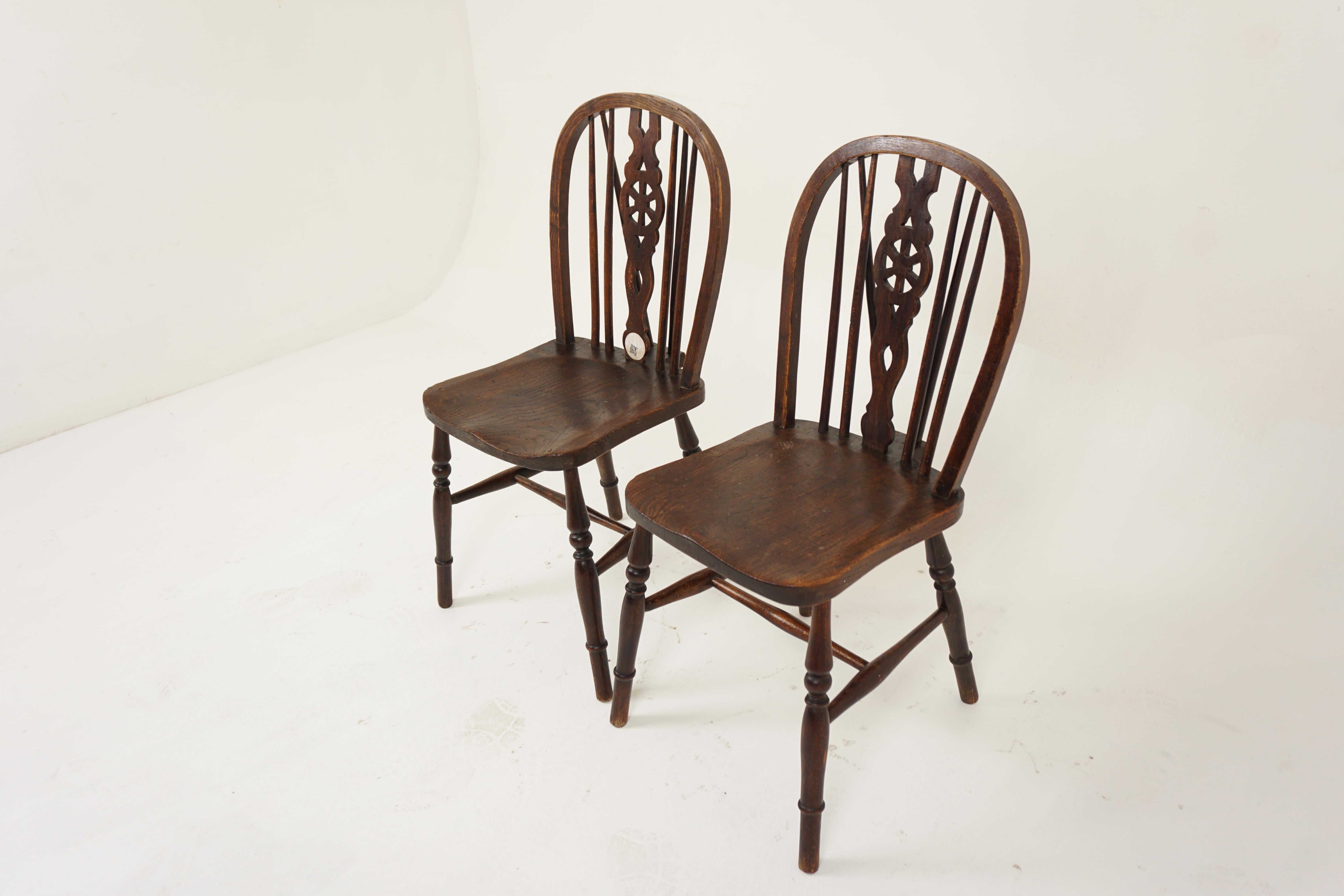 Pair Of Vintage Elm Wheelback Windsor Chairs, Scotland 1930, H1134

Scotland 1930
Solid Elm
Original finish
The chairs consist of a hoop back and central pierced splat
With wheeled design and turned spindles
Leading down to a solid elm