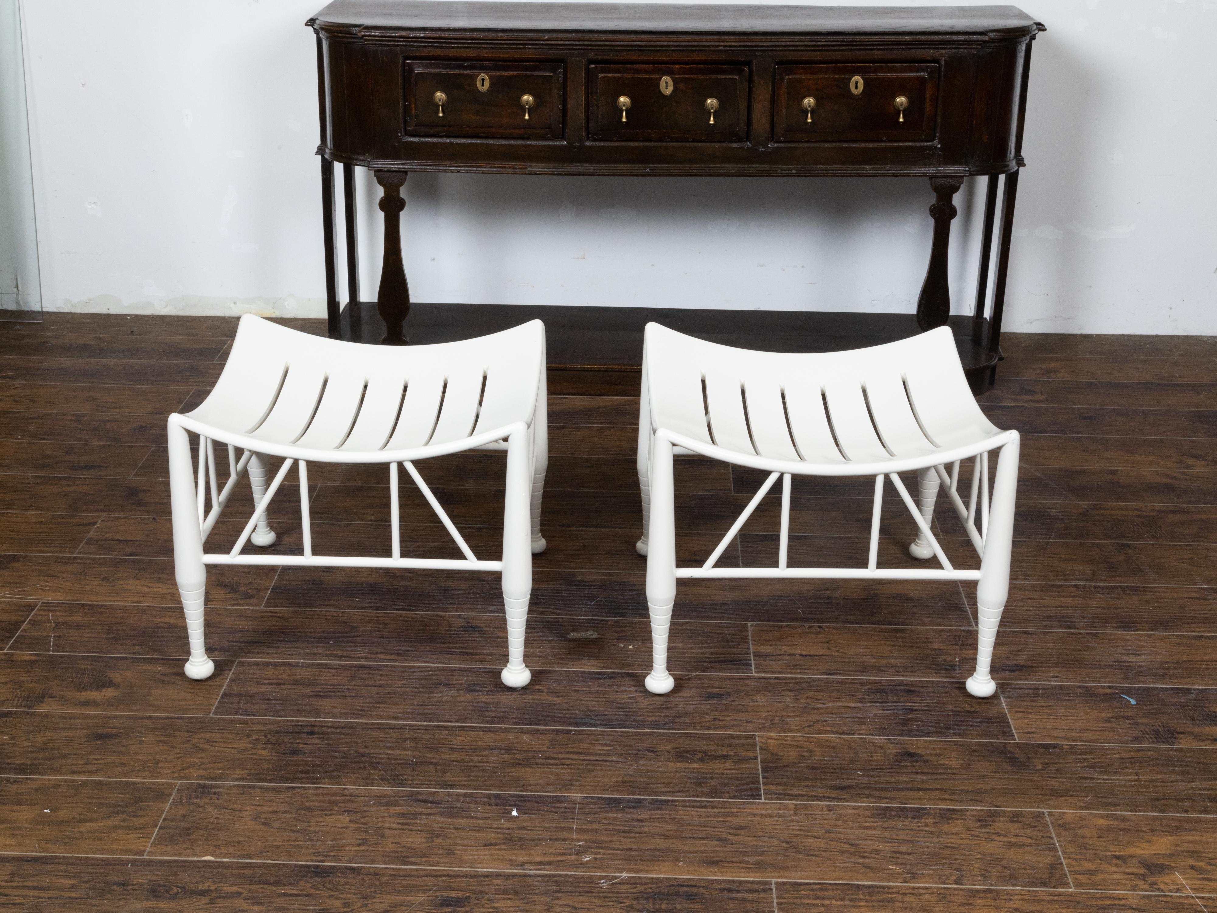 Pair of Vintage English Egyptian Revival White Thebes Stools with Curving Seats In Good Condition For Sale In Atlanta, GA