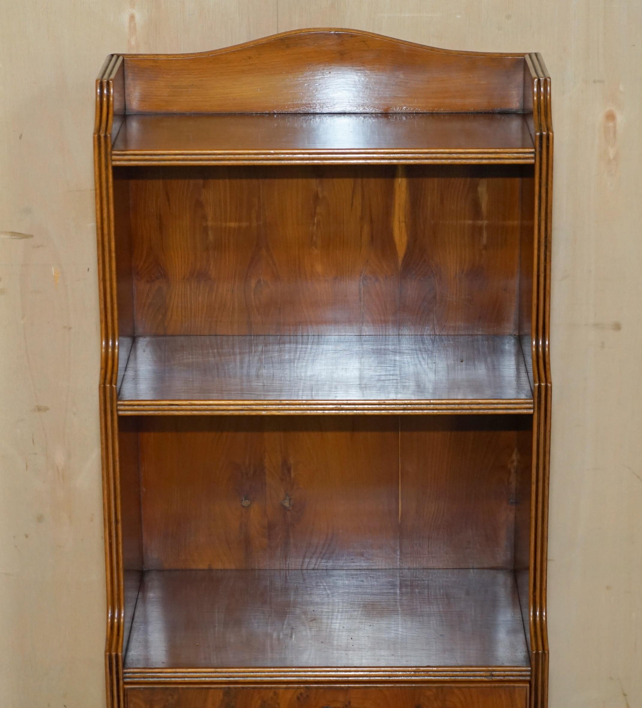 English PAIR OF ViNTAGE ENGLISH FLAMED HARDWOOD WATERFALL BOOKCASES WITH CUPBOARD BASES For Sale