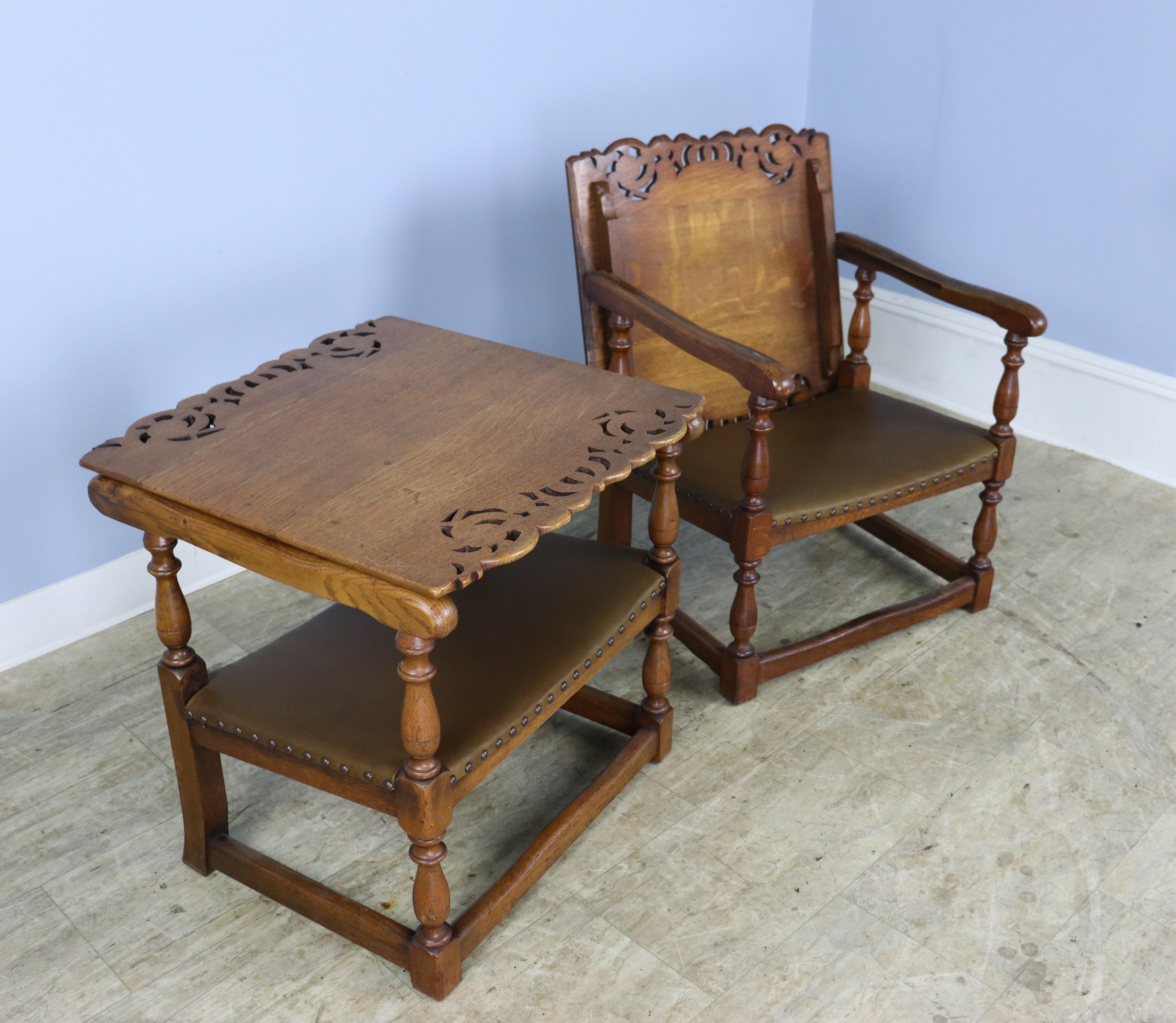 A very unique pair of chairs, surprising and delightful, with new leather seats. The craved backs and all over sensibility are a fine example of early 20th Century English furniture. The chairs, when closed, make a table, whose height is 21 1/2.