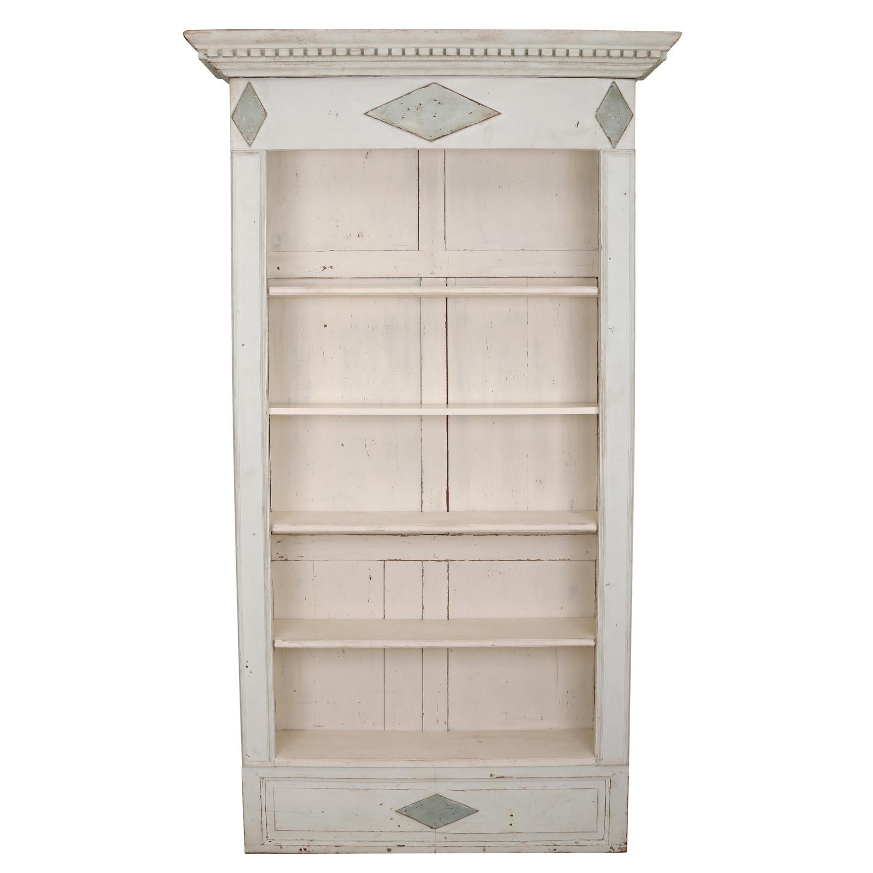 A super chic pair of vintage European narrow wood bookshelves with a gorgeous wood crown moulding detailed top.