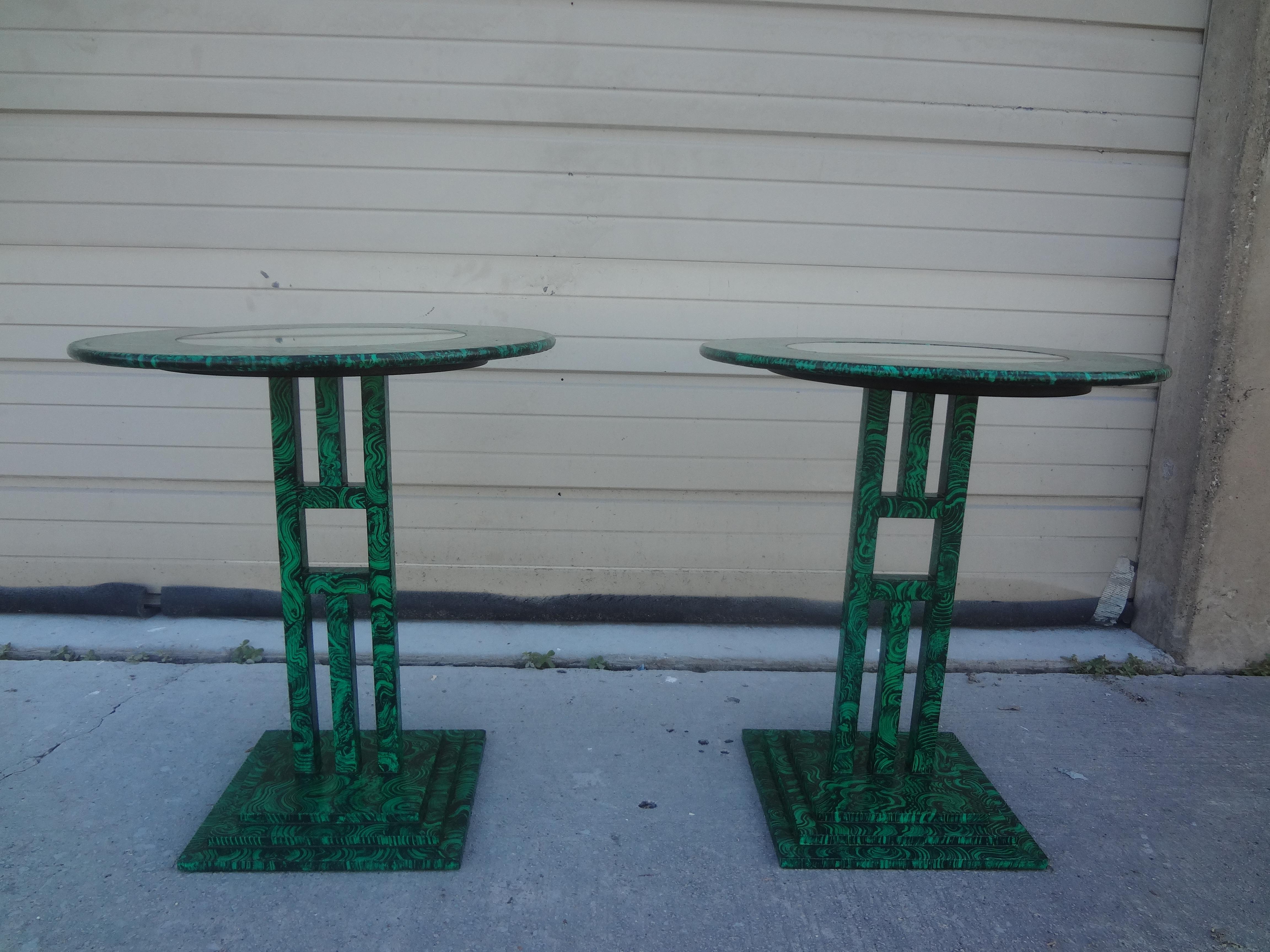 Pair of vintage Faux Malachite tables. This stylish pair of modernist style side tables, drink tables, gueridons or cigarette tables are realistically faux malachite decorated with mirrored tops surrounded by a band of faux malachite. Each table is