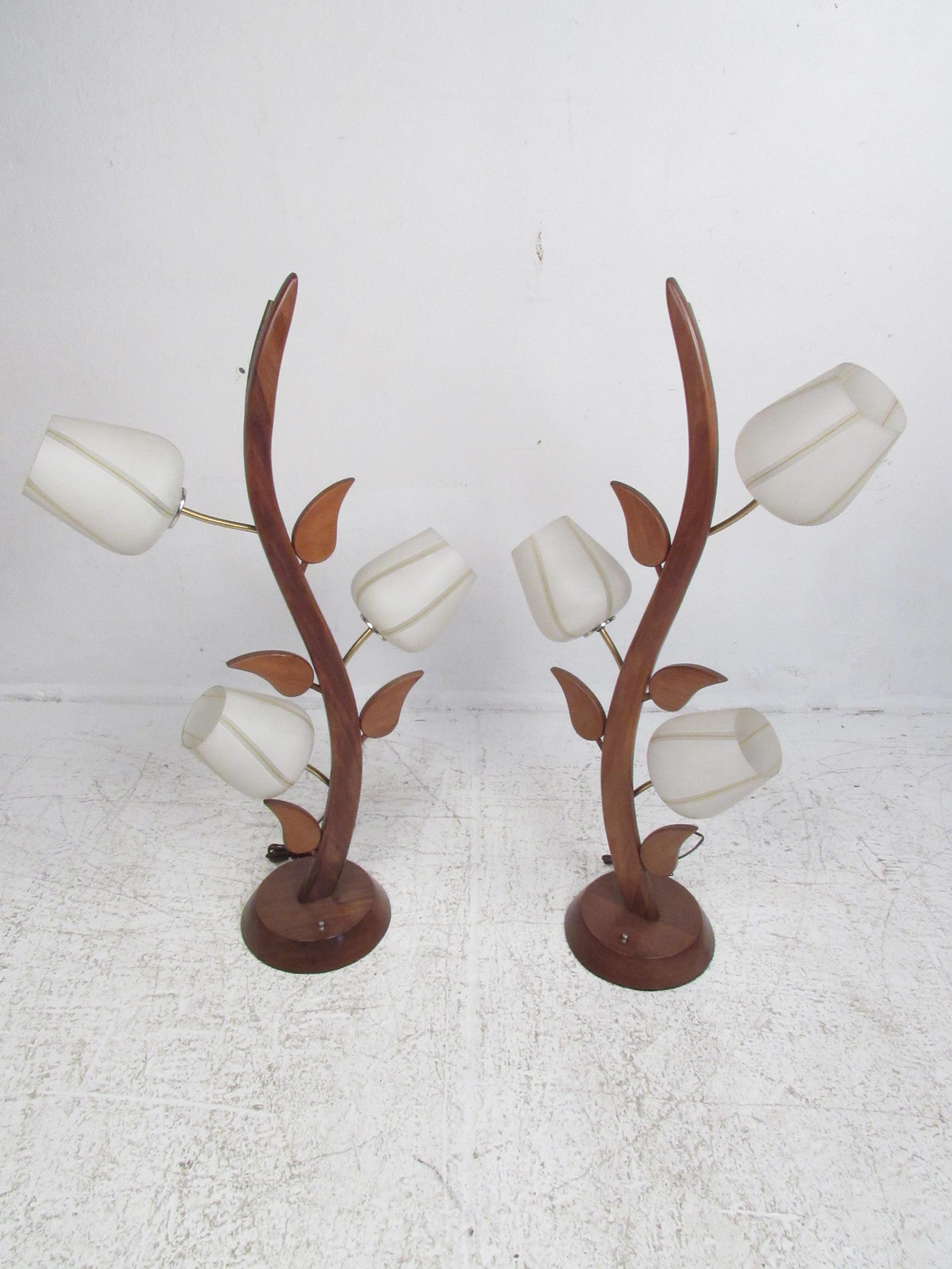 Very unusual pair of vintage lamps carved to resemble a flower or plant-life. Backed with a metal spine. Twist on/off mechanism. Re-wiring suggested for all vintage lighting or electrics. Please confirm item location with dealer (NJ or NY).