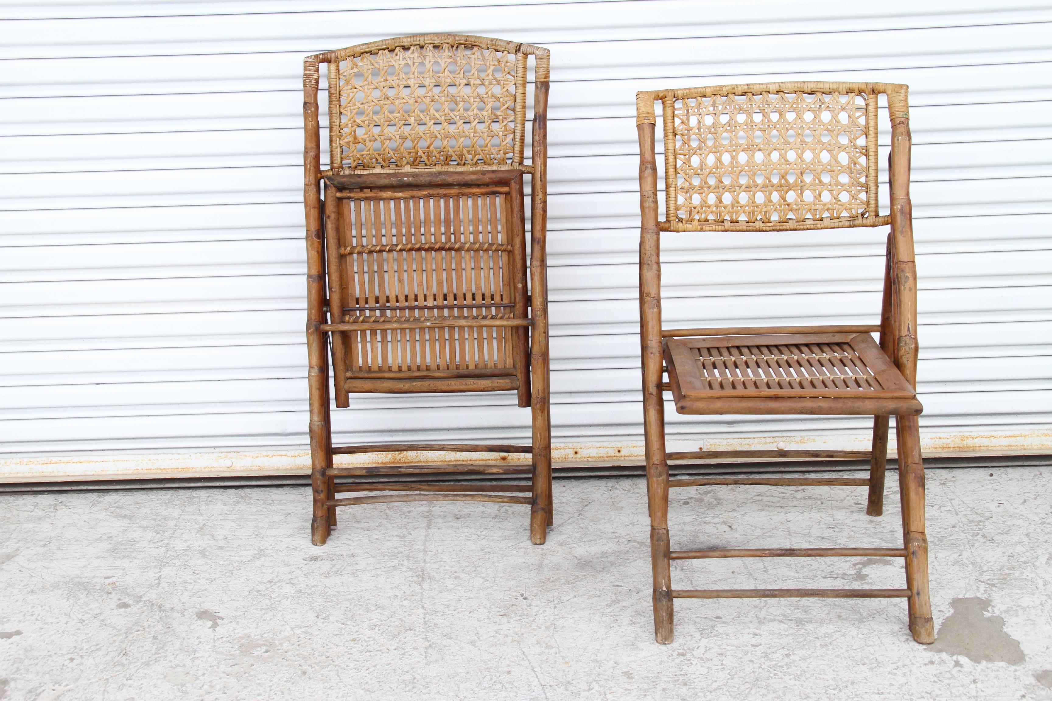 Pair of Vintage Folding Bamboo Chairs

Set of 2 vintage colonial campaign folding chairs, featuring bamboo frames shell with slatted bamboo seats and caned backs. 

Dims: 18