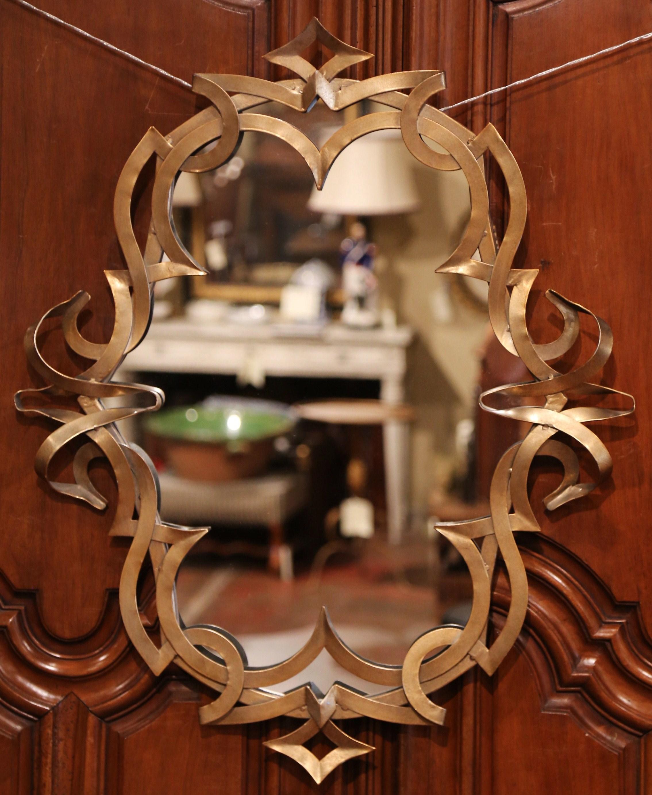 Decorate a master bathroom with this elegant pair of Art Deco mirrors. Crafted in France circa 1970, each mirror is decorated with intricate metal scroll around the frame. Both pieces are in excellent condition with a rich hand painted patinated