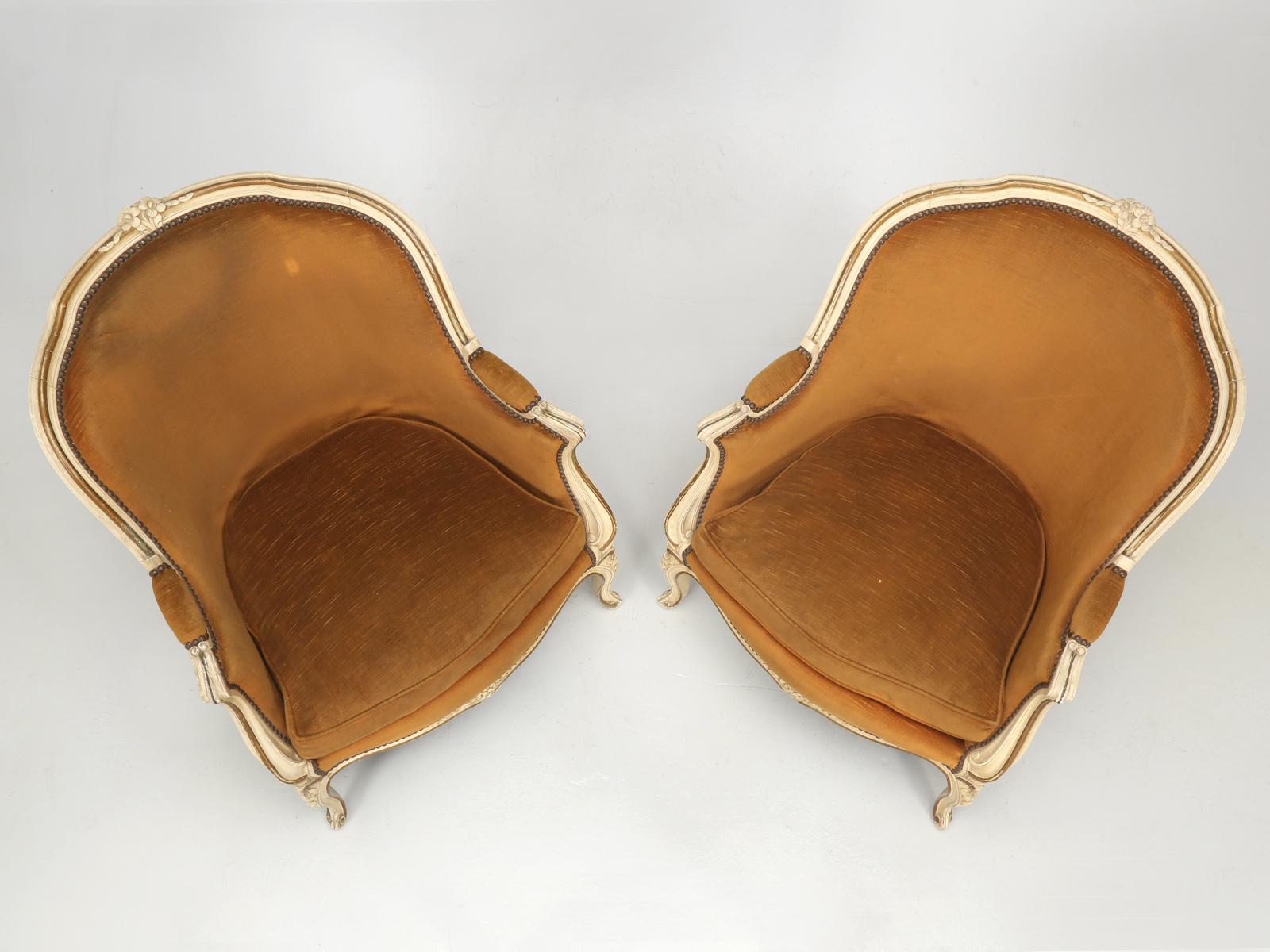 French vintage Louis XV style pair of Bergère chairs in their original paint and we believe the velvet fabric may also be original. We are also listing a third identical single Bergère chair on 1stdibs. This pair of vintage Louis XV style Bergère