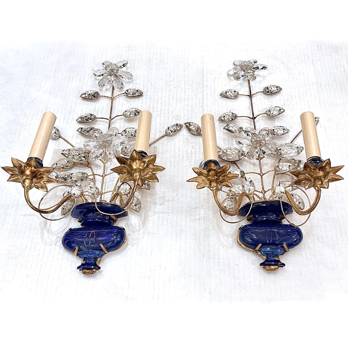 Pair of circa 1960's gilt sconces with blue molded glass body. 

Measurements:
Height: 18