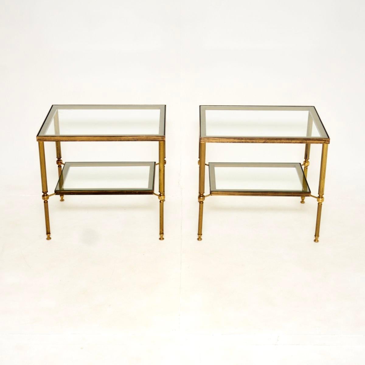 A superb pair of vintage French brass and glass side tables. They were made in France, and date from around the 1960’s.

The quality is outstanding, they are a fantastic size and have a very useful design. Each has two clear glass tiers, the solid