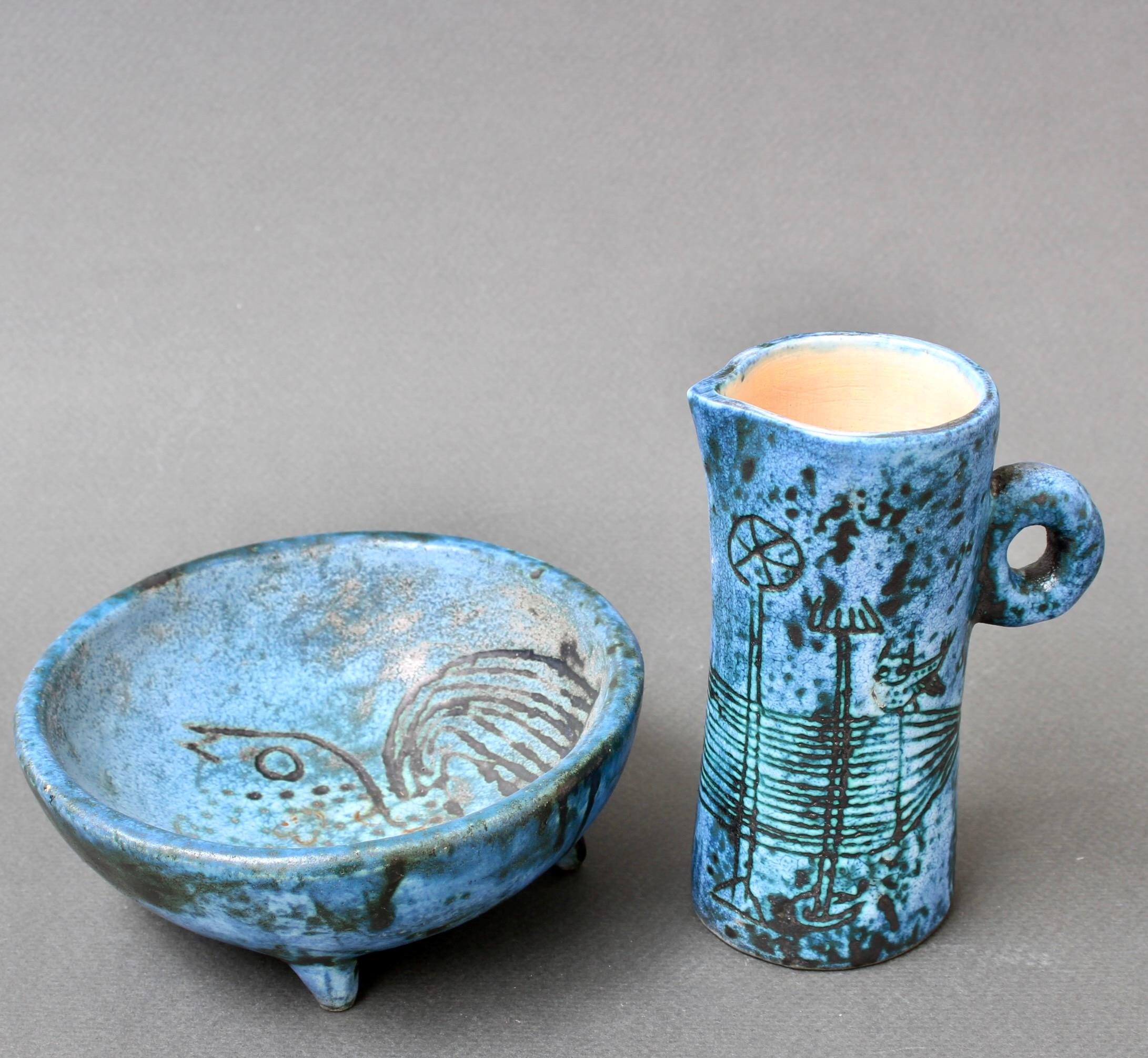 This diminutive pair of French vintage ceramic pieces have Blin's trademark cloudy blue glaze featuring primeval images of birds, animals and plants - seemingly from an undiscovered cave - etched in and around the small vessels. They are both in