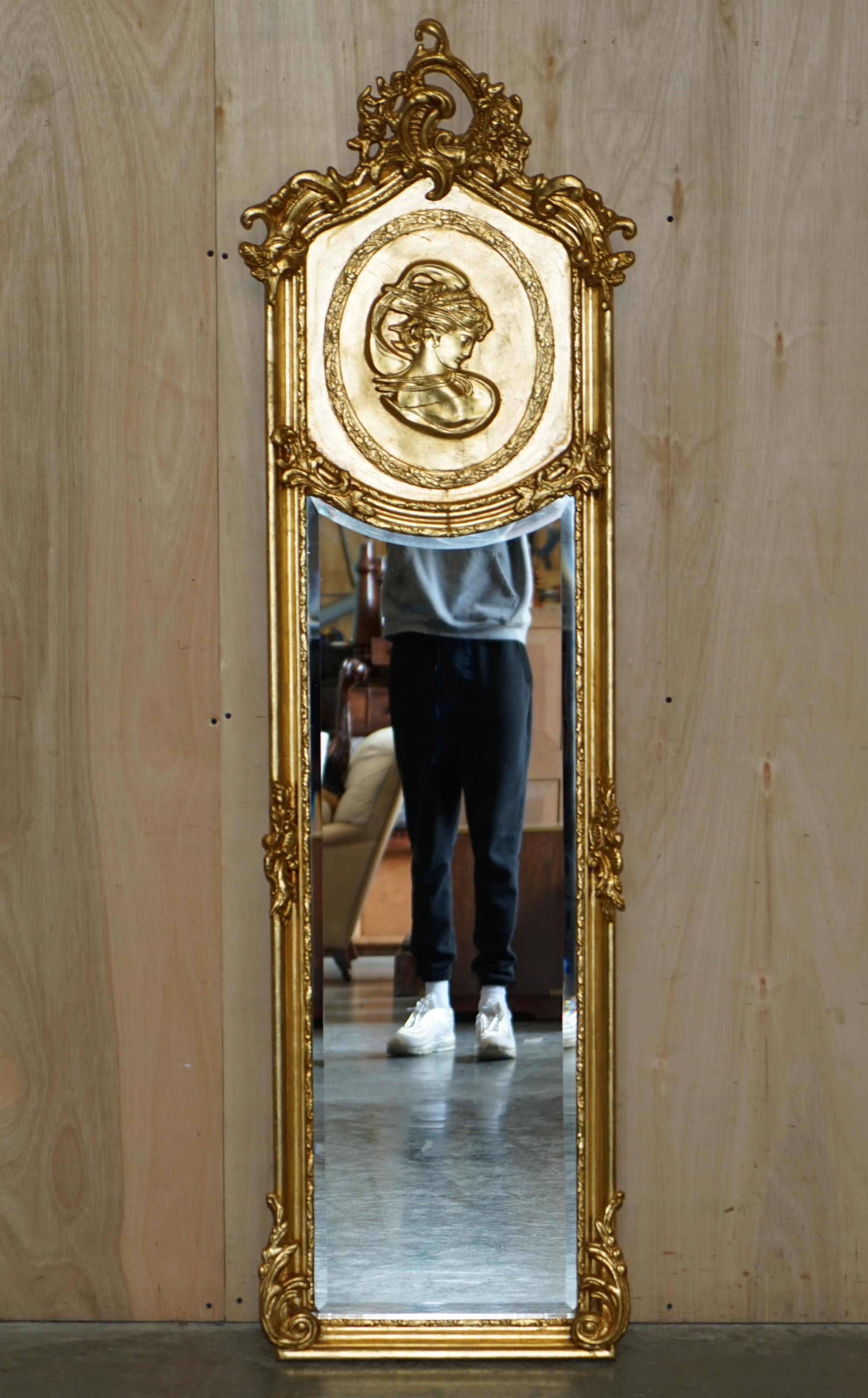 We are delighted to offer for sale this original lovely pair of mid-20th century French Neoclassical style giltwood framed mirrors

Both in lovely vintage condition, the giltwood is vibrant and adds a sense of Parisian opulence to any setting.