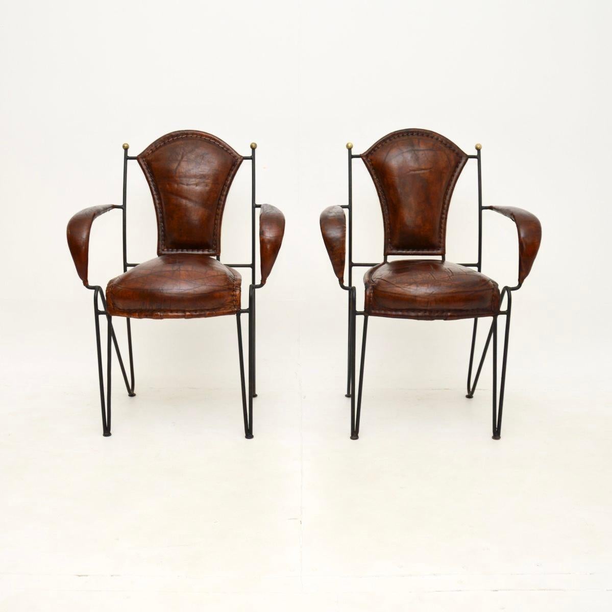A stunning pair of vintage French iron and leather armchairs, dating from around the 1960’s.

This model is often attributed to Jacques Adnet, they are of superb quality and is extremely stylish.

The iron frames are beautifully designed and have