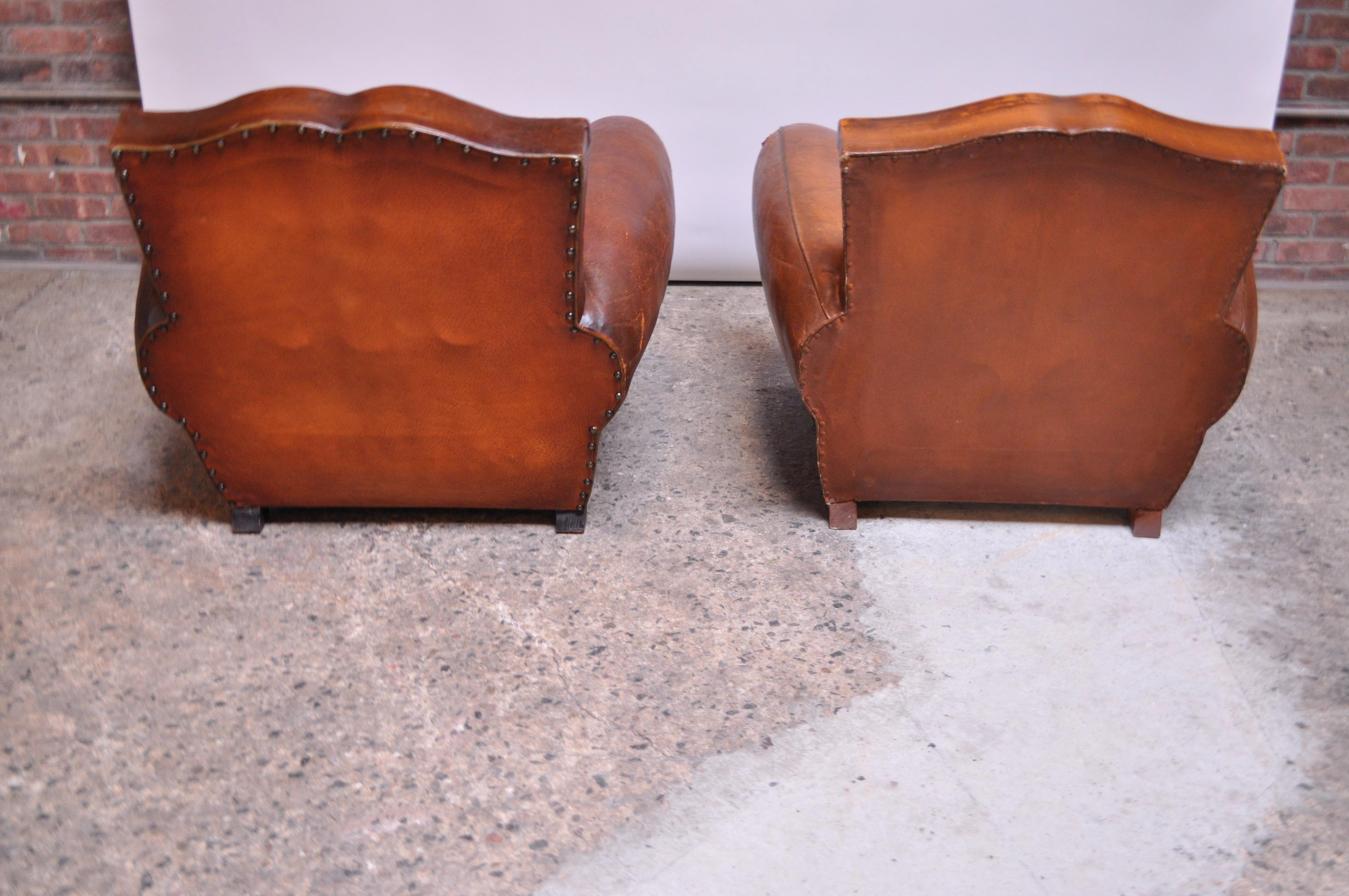 Pair of Vintage French Leather 'Mustache' Club Chairs In Distressed Condition In Brooklyn, NY