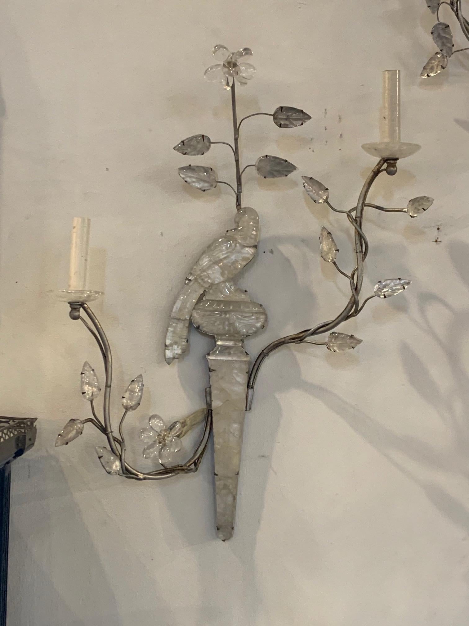 Amazing pair of vintage French Maison Bagues rock crystal and silver leaf parrot form sconces. Each has 2 lights. So unique! A beautiful decorative element.