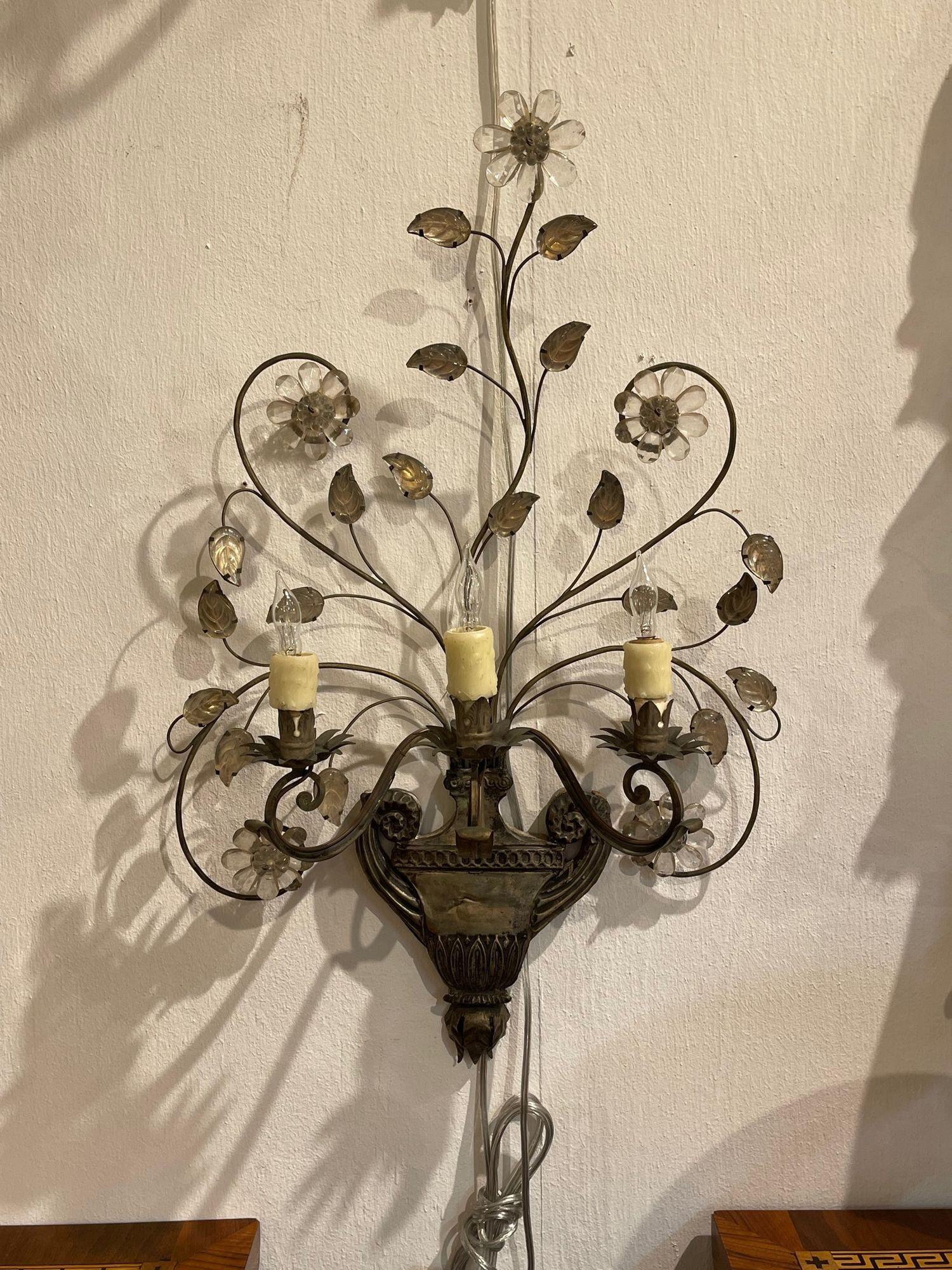 Very fine pair of vintage French Maison Bagues tole and crystal sconces. Lovely patina on these along with a swirling design and crystal flowers. So pretty!! Great for a traditional home.