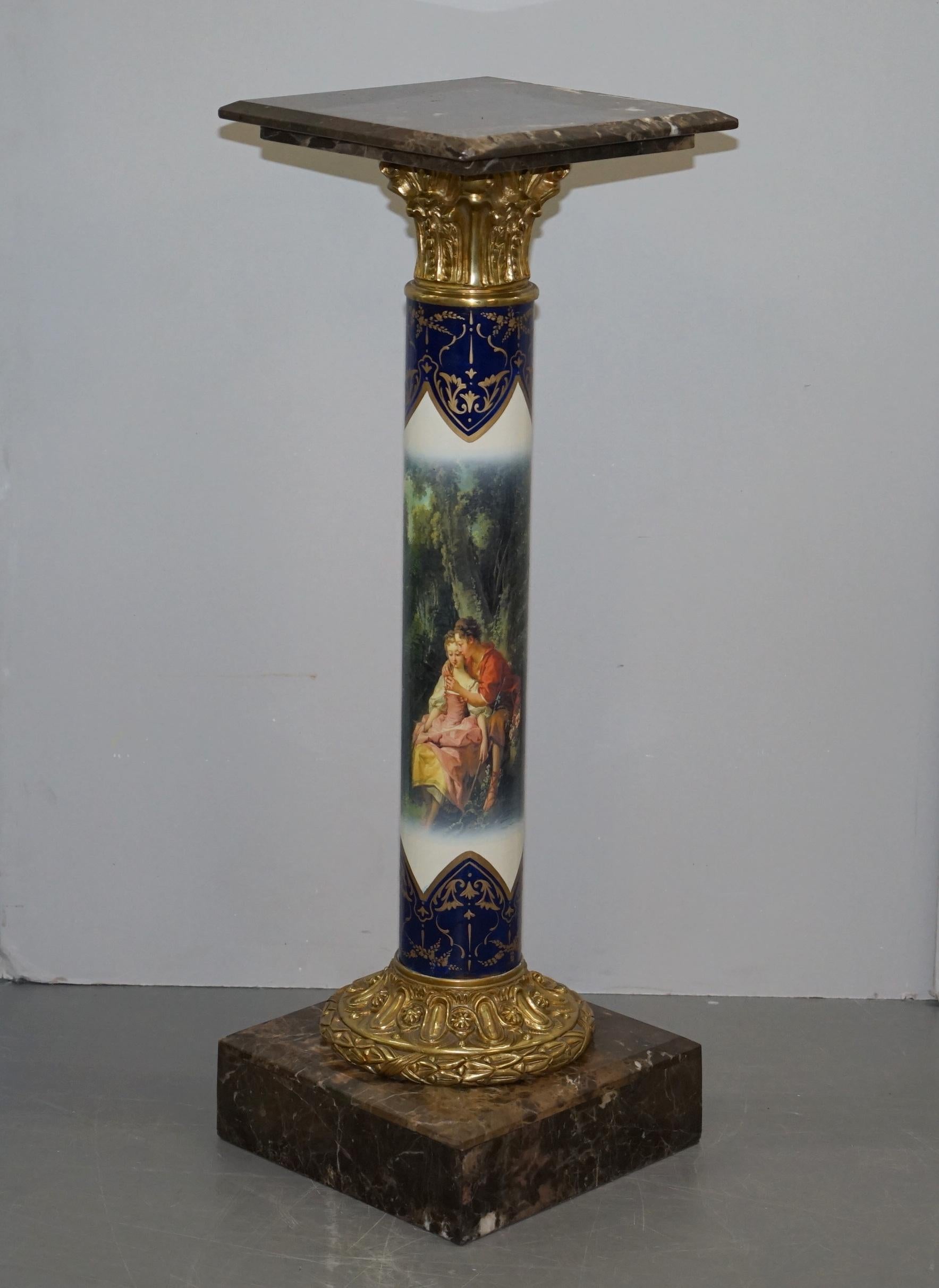 We are delighted to offer for sale this stunning pair of early 20th century circa 1920s French marble and gilt bronze pedestal pillars with hand painted porcelain bodies depicting lovers in a rural setting

These are quite simply the most