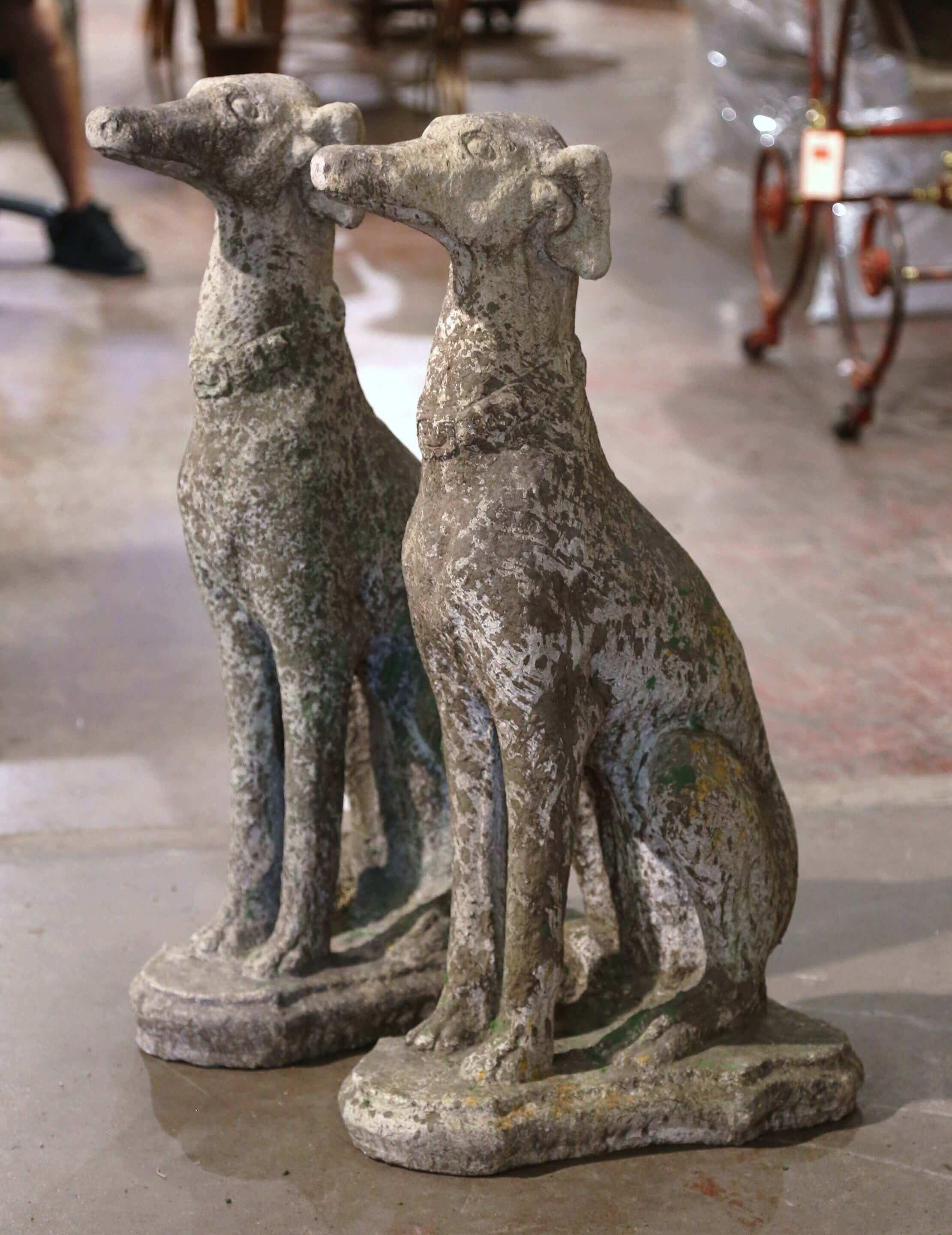 Cast Stone Pair of Vintage French Outdoor Weathered Carved Stone Greyhound Dog Sculptures