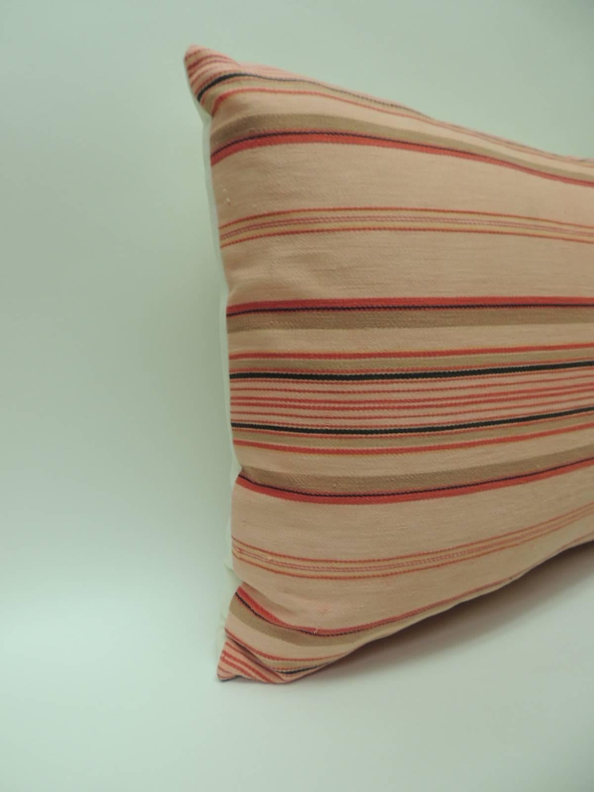 Pair of vintage French pink and red stripes lumbar decorative pillows
French Provincial linen ticking stripes lumbar decorative pillows in shades of light pink, dark pink, red, taupe, tan and natural with a natural linen backings. French Provincial