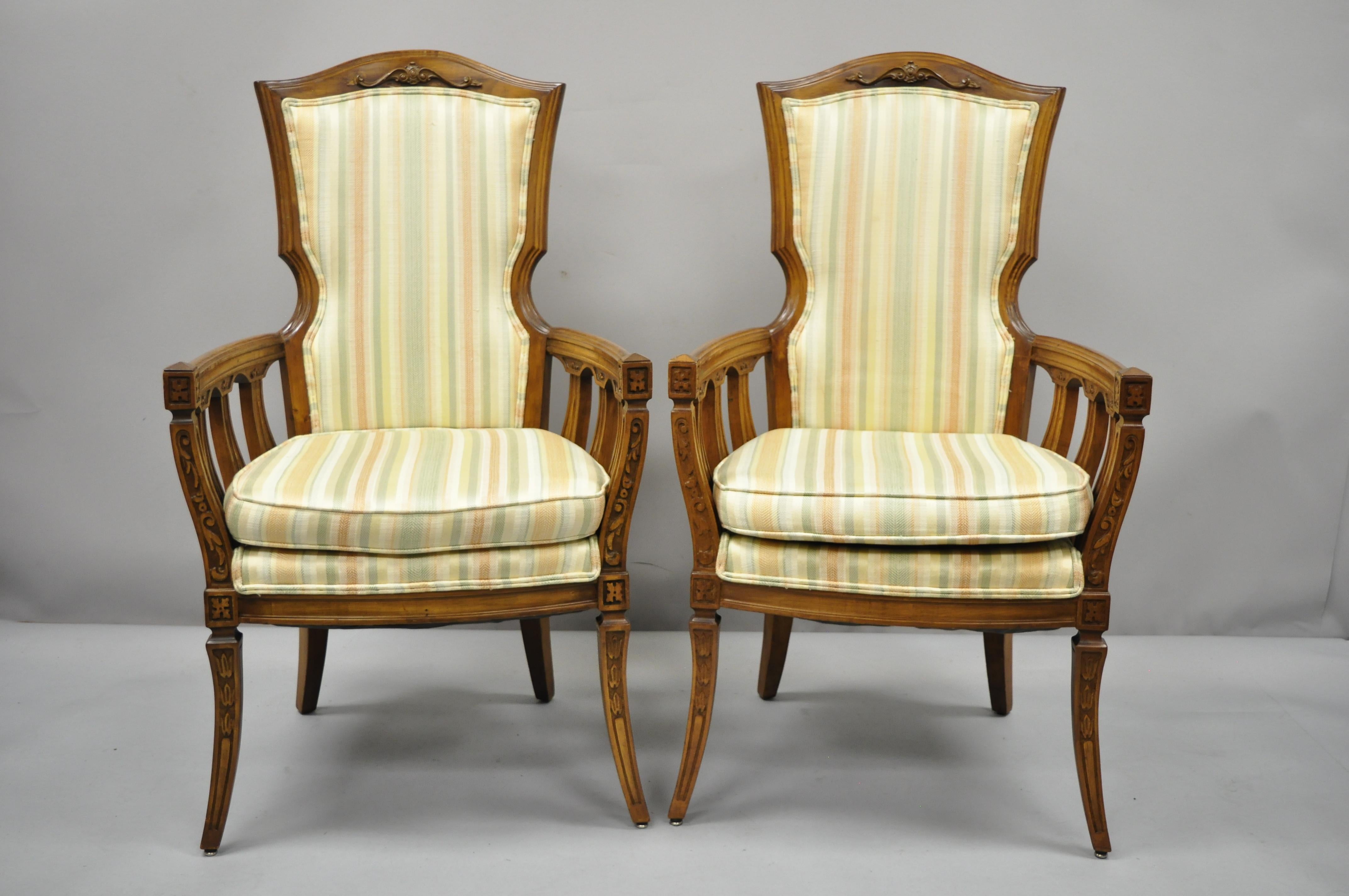Pair of vintage French provincial Hollywood Regency tall back lounge armchairs. Item features tall comfortable backs, solid wood frame, nicely carved details, tapered legs, great style and form. Mid-20th century. Measurements: 44.5
