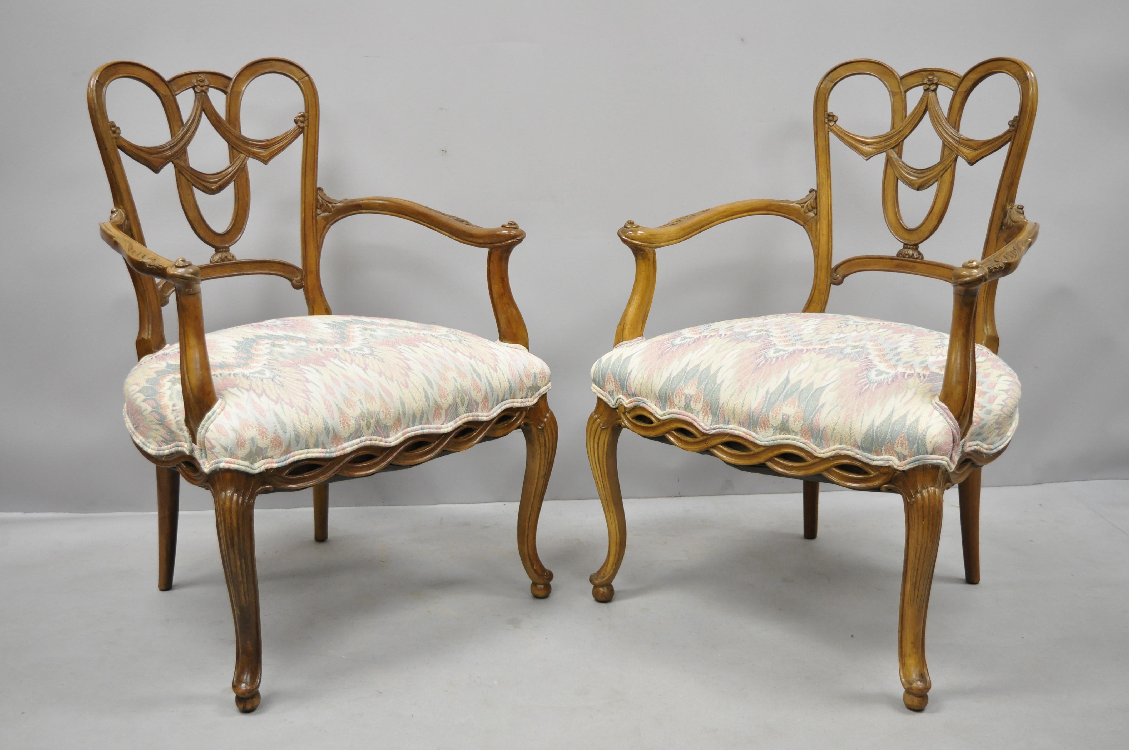 Pair of vintage French Provincial Louis XV style drape carved dining armchairs. Items feature drape carved backs, spiral carved lower rails, solid wood construction, cabriole legs, quality American craftsmanship, great style and form, circa 1950s.