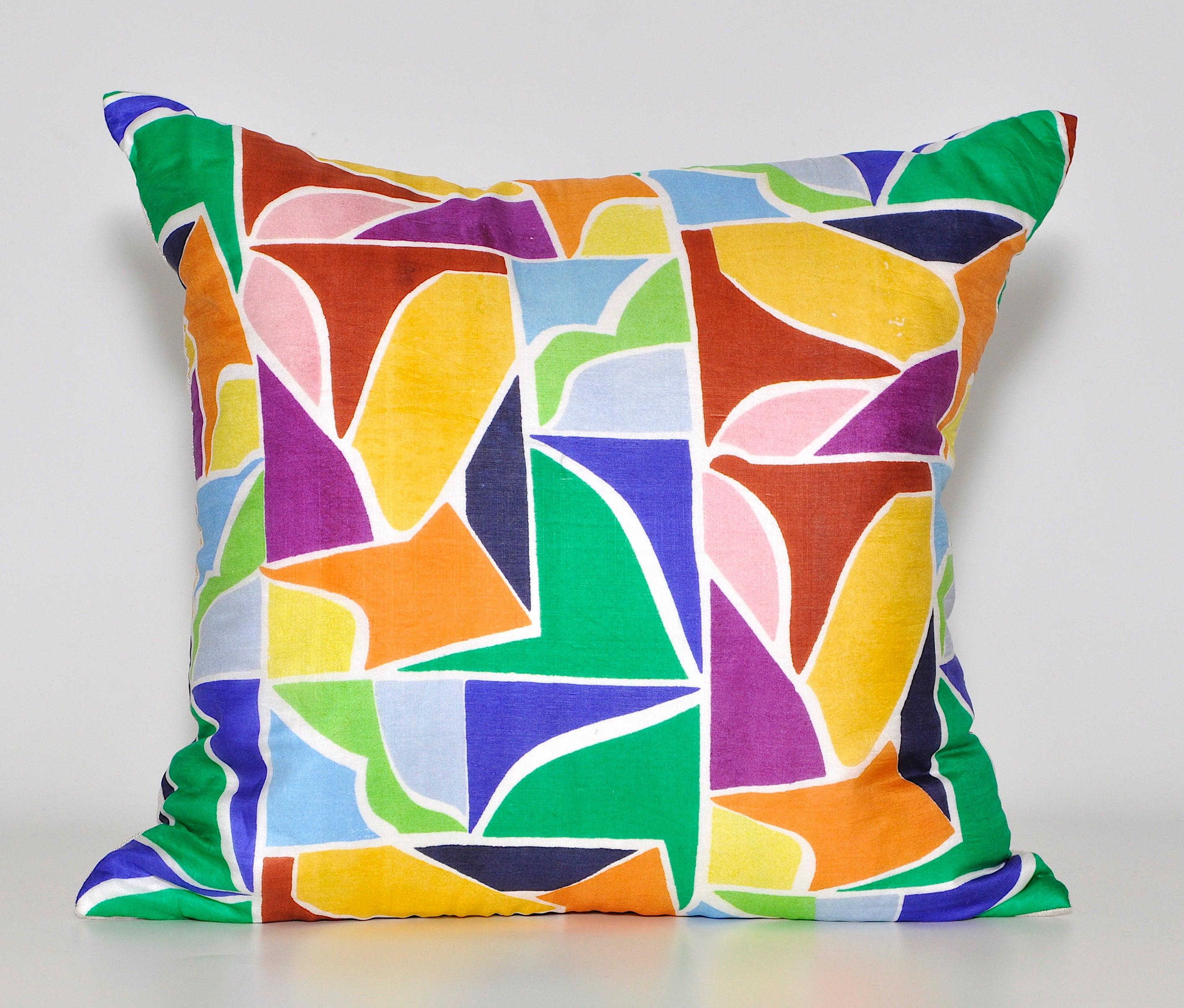 Unique custom made one-of-a-kind cushions (pillows) created from a stunning vintage silk 1960s fashion scarf in an eye catching multicolored geometric pattern. The design is reminiscent of stained glass with strong hues emphasized and brightened by