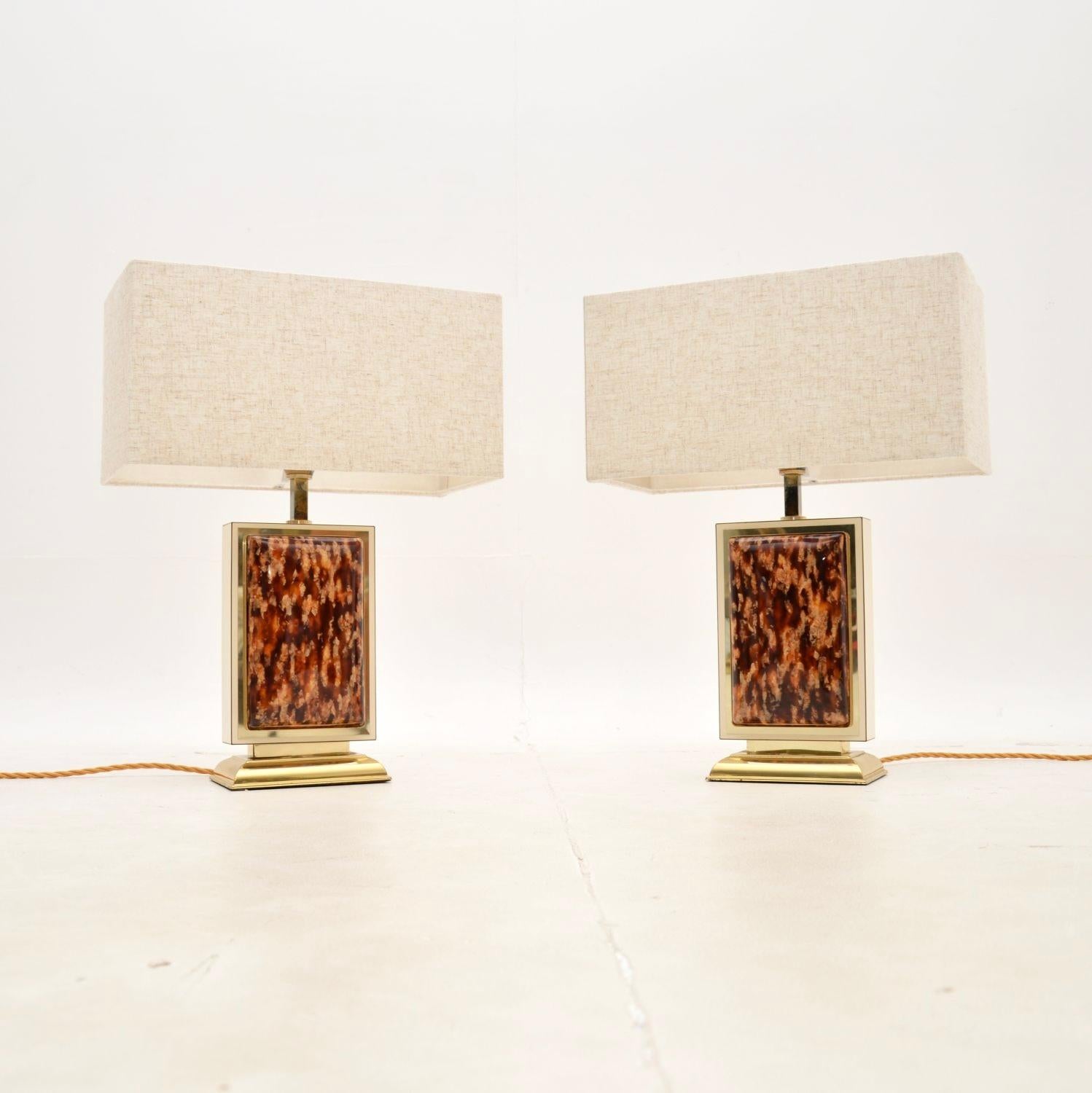 A very stylish and well made pair of vintage French table lamps. They were recently imported from France, they date from the 1970’s.

They are of great quality with a fantastic design, the front and backs have a slightly padded tortoise shell effect