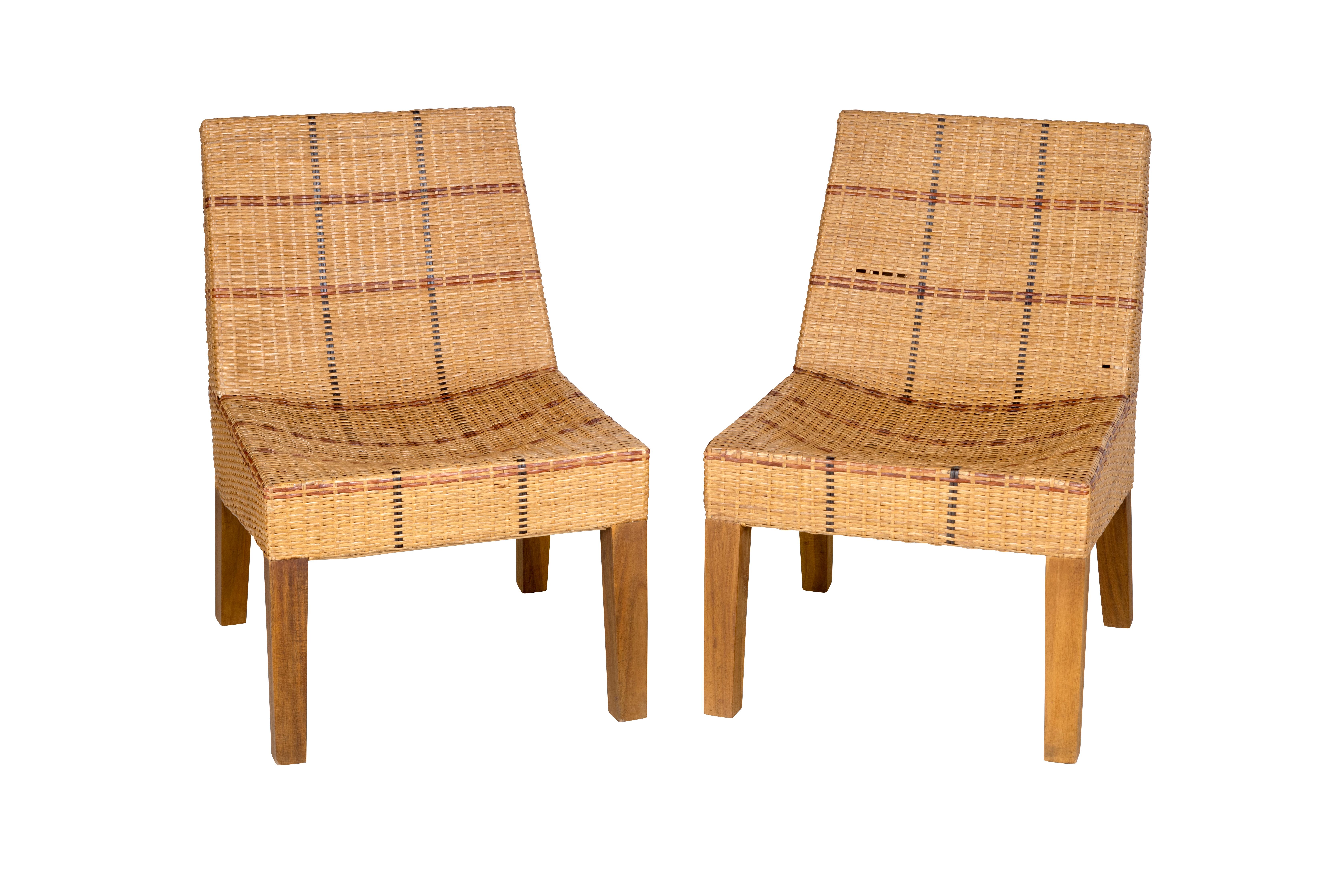 Pair of vintage 1970s chairs and ottoman set. Hand-woven tri-tone rattan. Some holes and wear in the rattan.

The piece is a part of our one-of-a-kind collection, Le Monde. Exclusive to us. 

Globally curated by Brendan Bass, Le Monde furniture