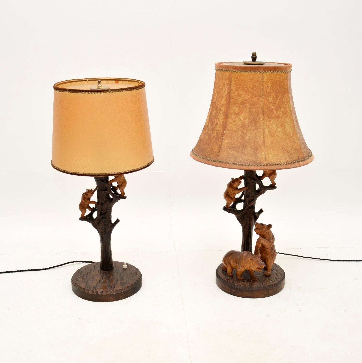 A charming matched pair of vintage German black forest table lamps. They were recently imported from Germany, they date from around the 1950’s.

The quality is superb, the stands are beautifully carved depicting tree trunks, and each has wonderful