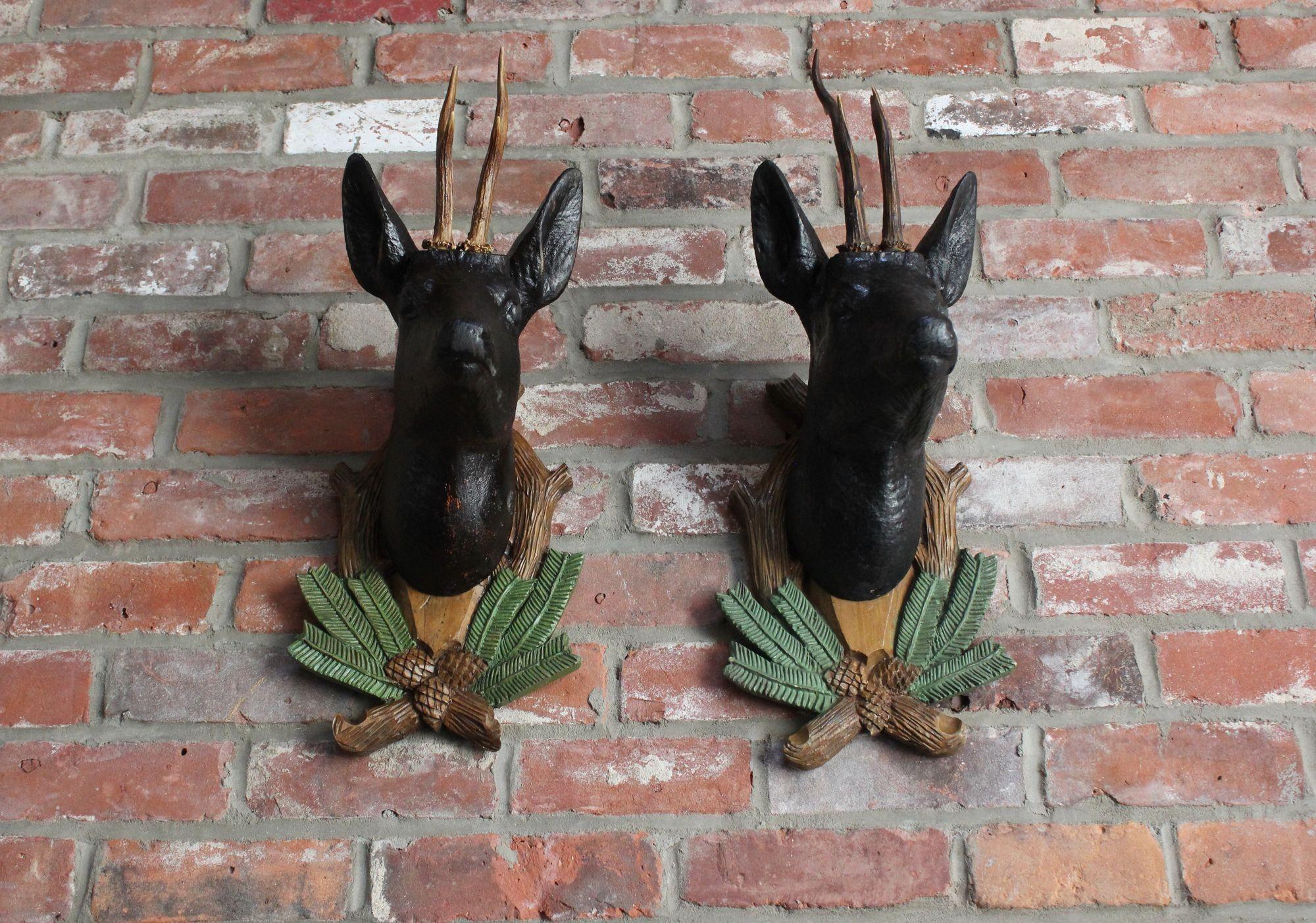 Antler Pair of Vintage German Carved Black Forest Mounted Deer Wall Sculptures For Sale