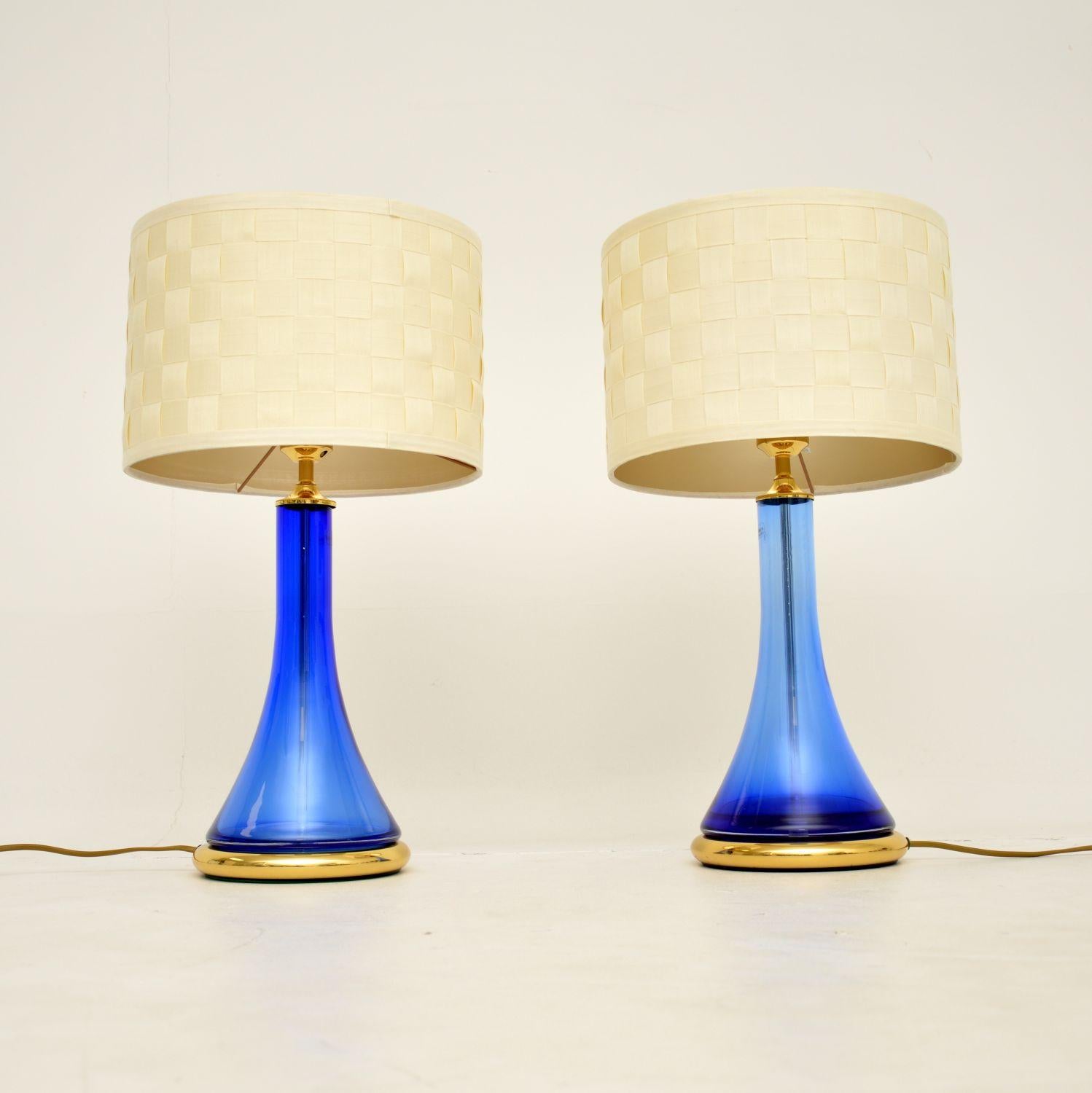 A stunning pair of vintage table lamps in blue glass and brass. These were made in Germany by Nachtmann, they date from around the 1970-1980’s.

The quality is superb, these are beautifully designed and are a great size.

The condition is