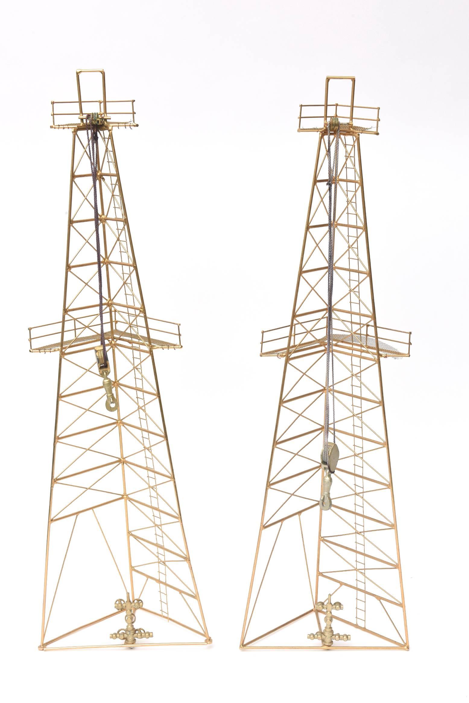 These unusual and vintage gilt metal oil rig tower sculptures make either a free standing sculpture on a table or best as a wall sculpture. They are from the 1970s. These look like the rendition of a total oil rig tower. For those of you in the oil