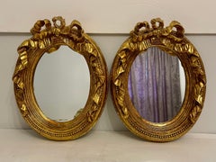 Pair of Vintage Gilt Bow Top Mirrors
