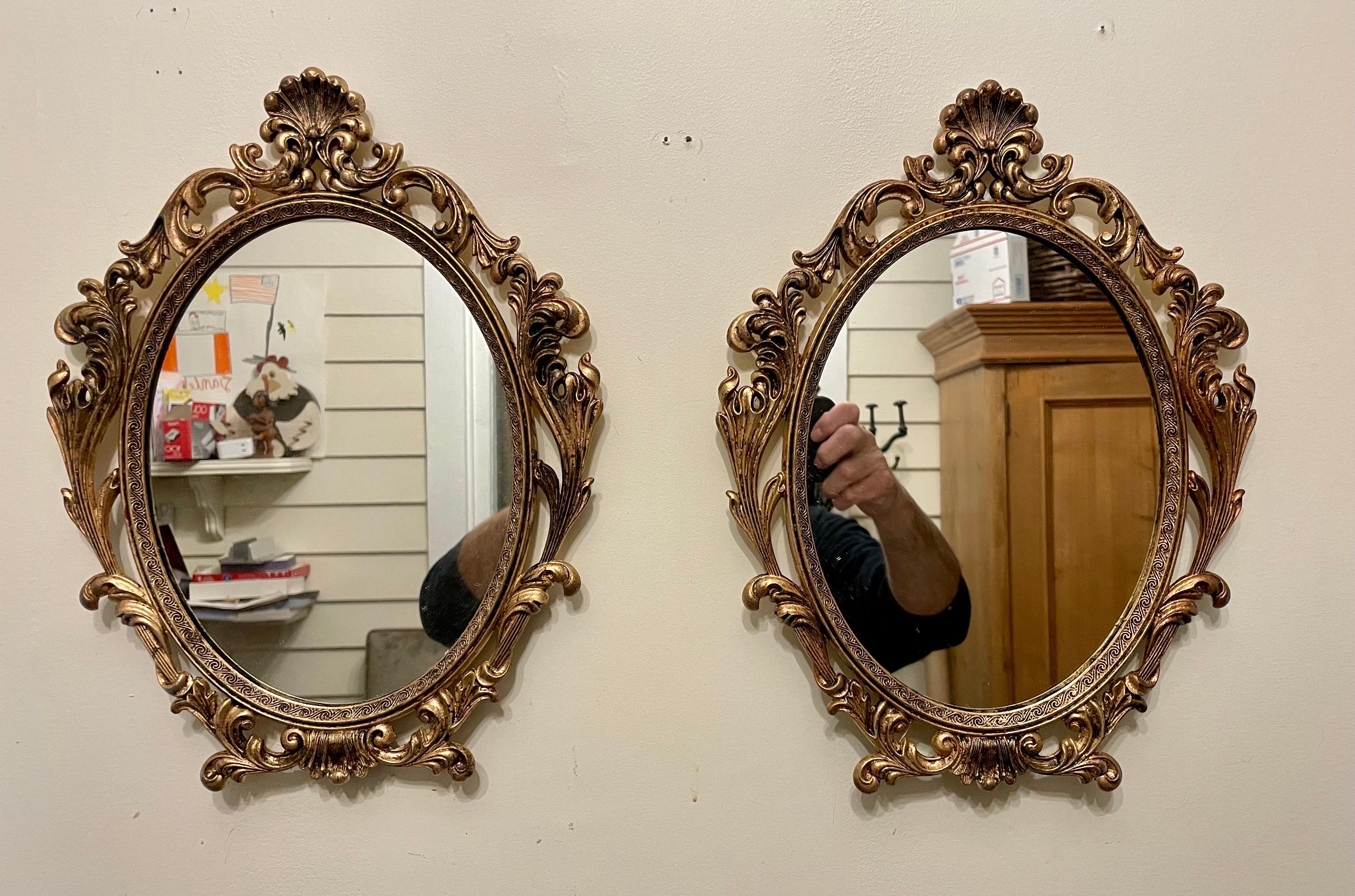 Pair Italian gilt finish metal mirrors. Nice detailed casting. Each mirror is 13