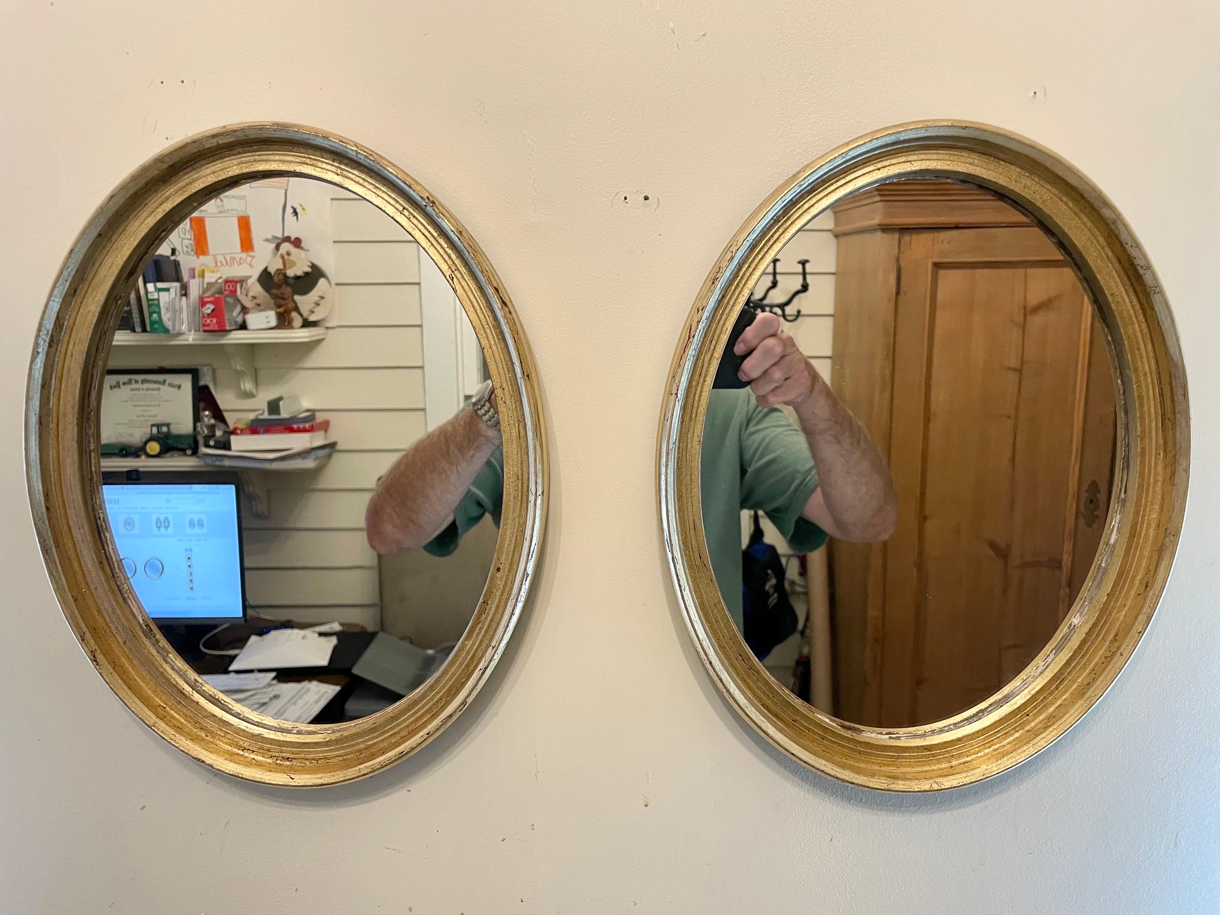 Pair Italian gilt oval mirrors.  Each mirror is 13