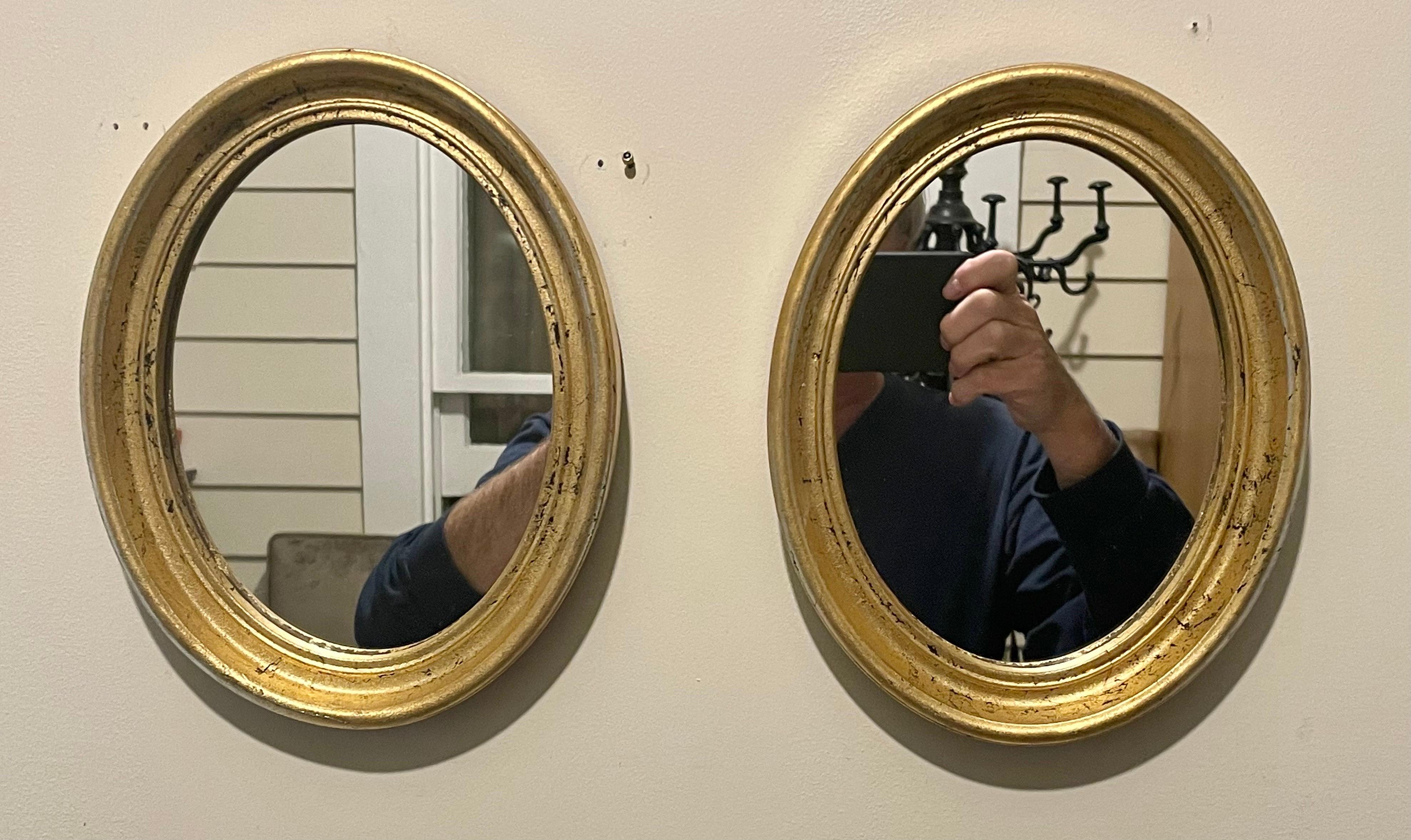 Pair Italian gilt oval mirrors.  Each mirror is 9