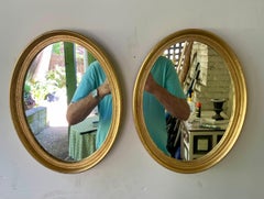 Pair Of Vintage Gilt Oval Italian Mirrors