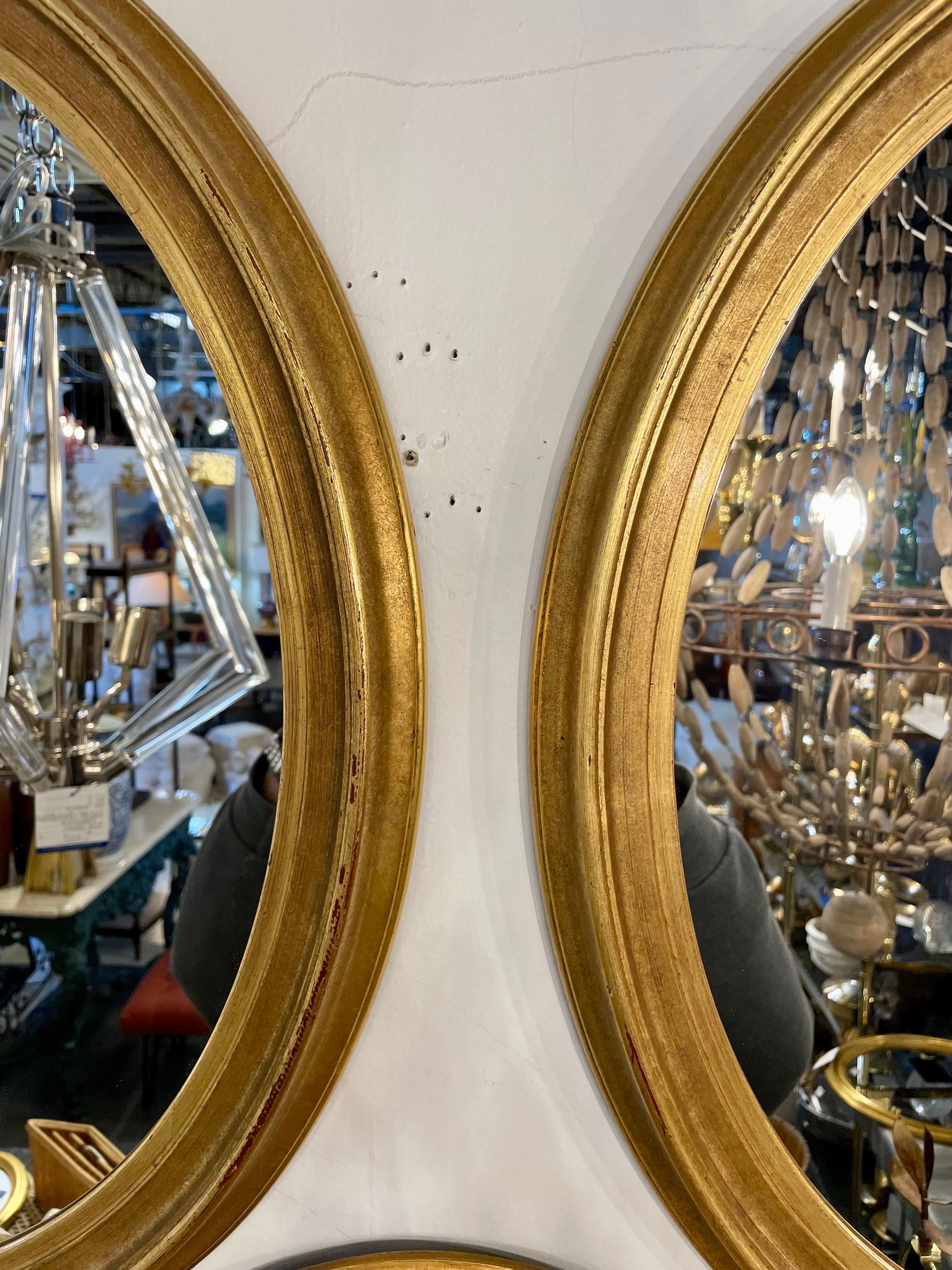 20th Century Pair of Vintage Gilt Oval Italian Mirrors