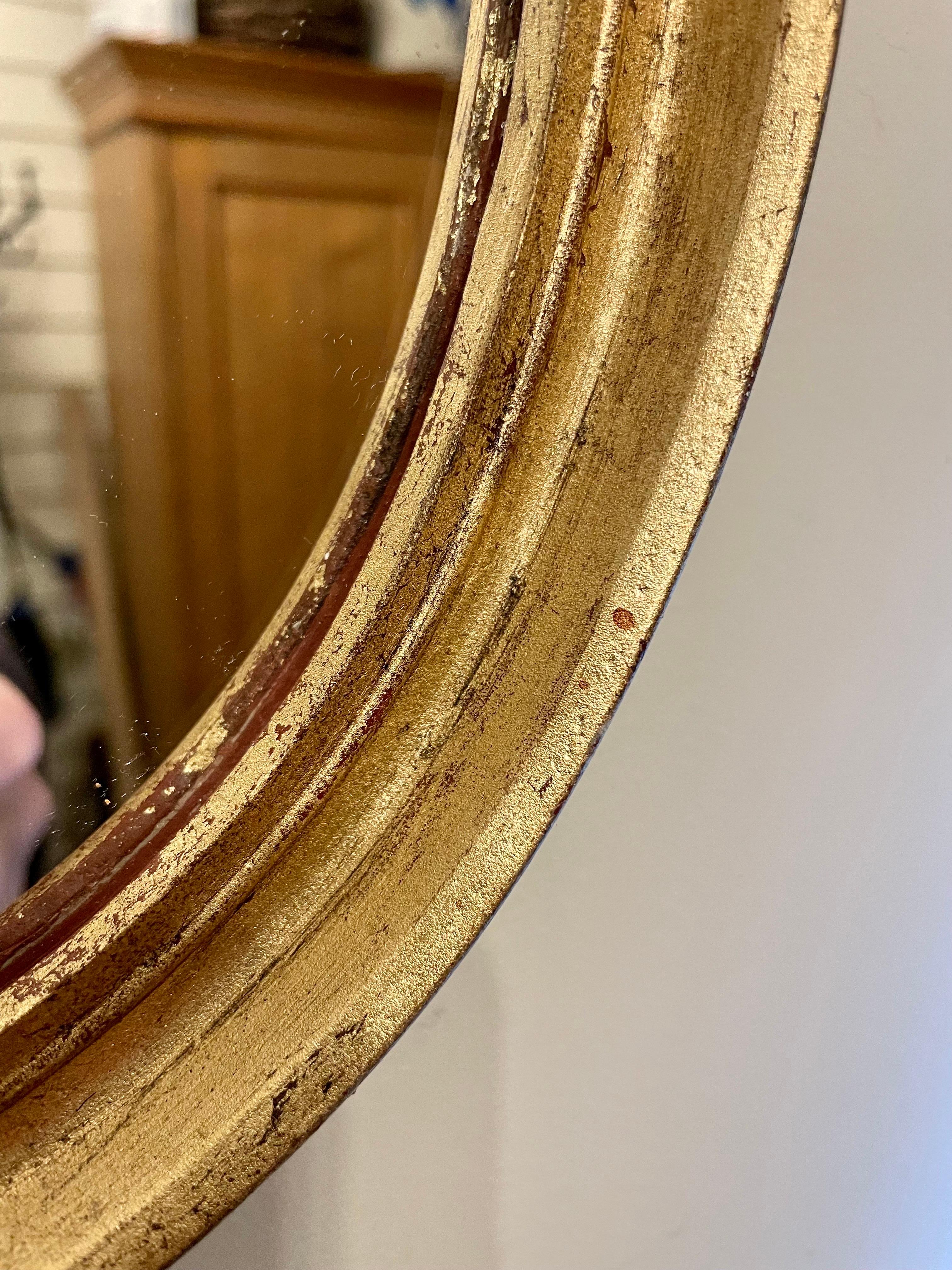 20th Century Pair of Vintage Gilt Oval Italian Mirrors