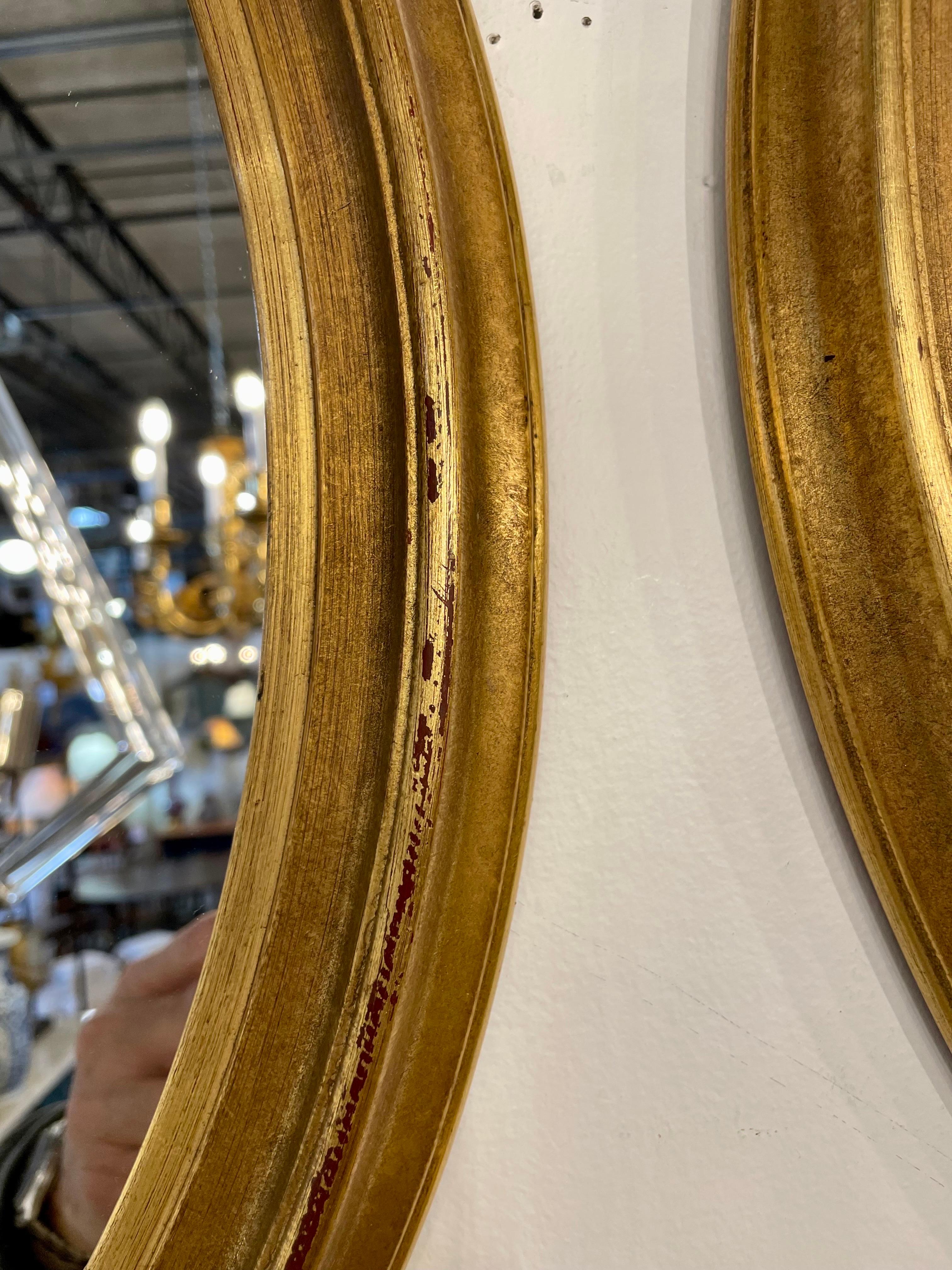 Pair of Vintage Gilt Oval Italian Mirrors 1