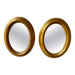 Paire de miroirs italiens ovales dorés vintage