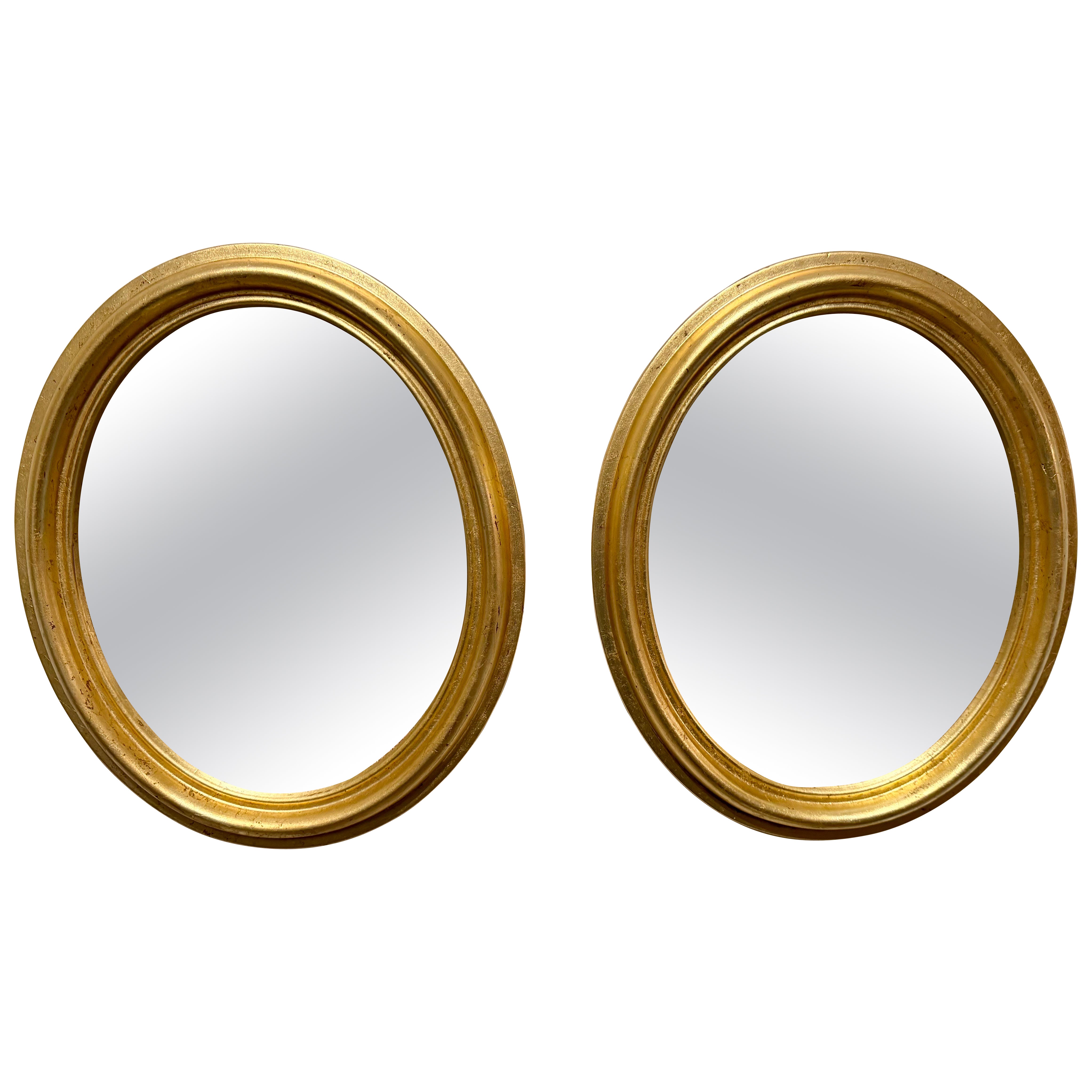 Coppia di specchi ovali dorati d
epoca italiani