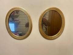 Pair of Vintage Gilt Oval Mirrors