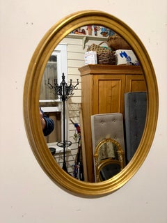 Pair of Vintage Gilt Oval Mirrors
