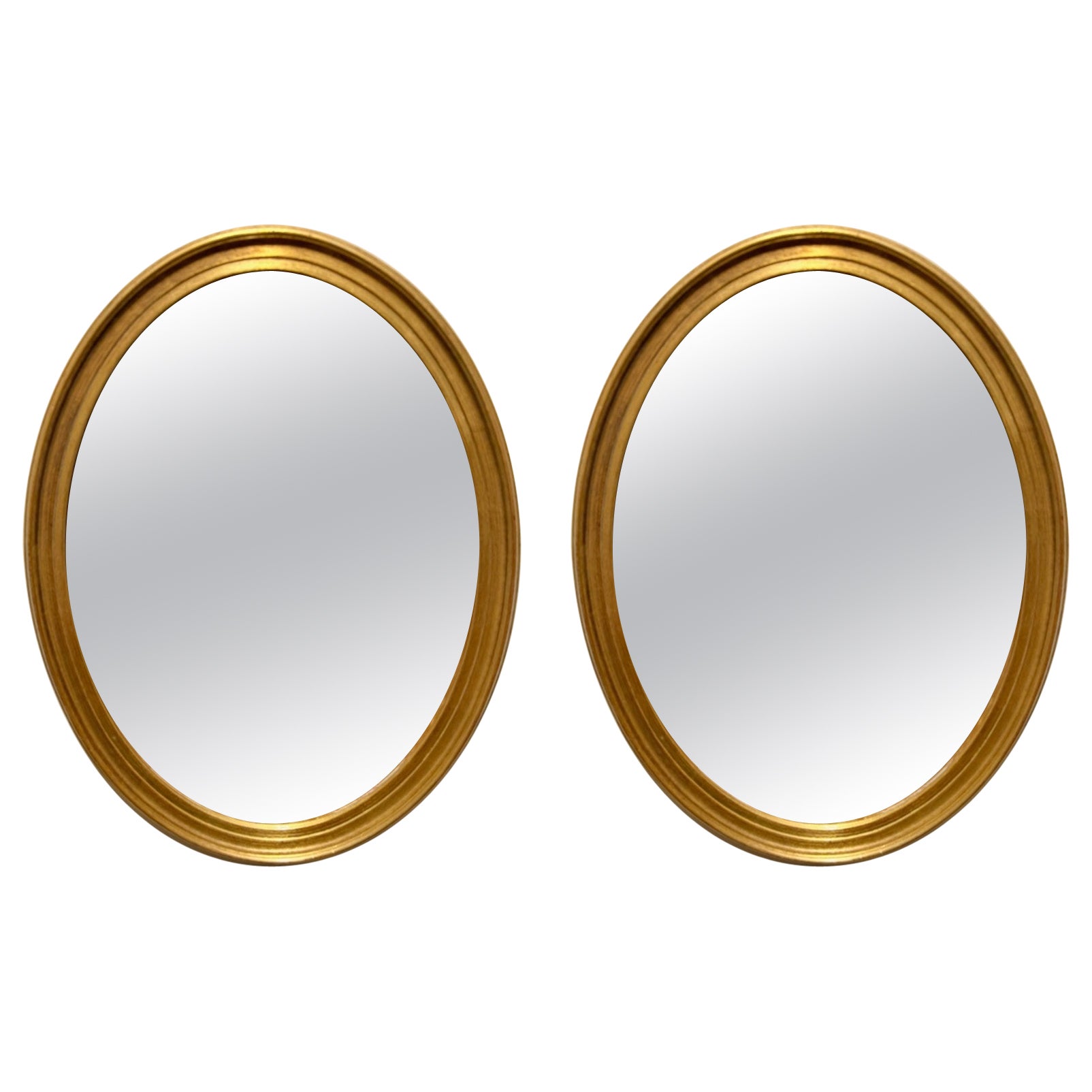 Coppia di specchi ovali dorati vintage