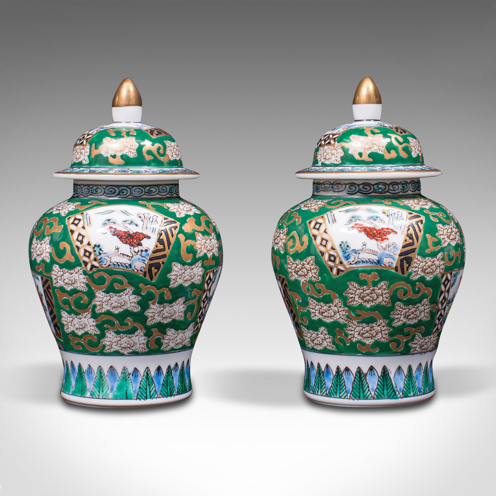 This is a pair of vintage ginger jars. A Chinese, hand painted ceramic spice pot, dating to the Art Deco period, circa 1940.

Appealing colour and bulbous forms
Displaying a desirable aged patina and in good order
Hand-painted ceramic with
