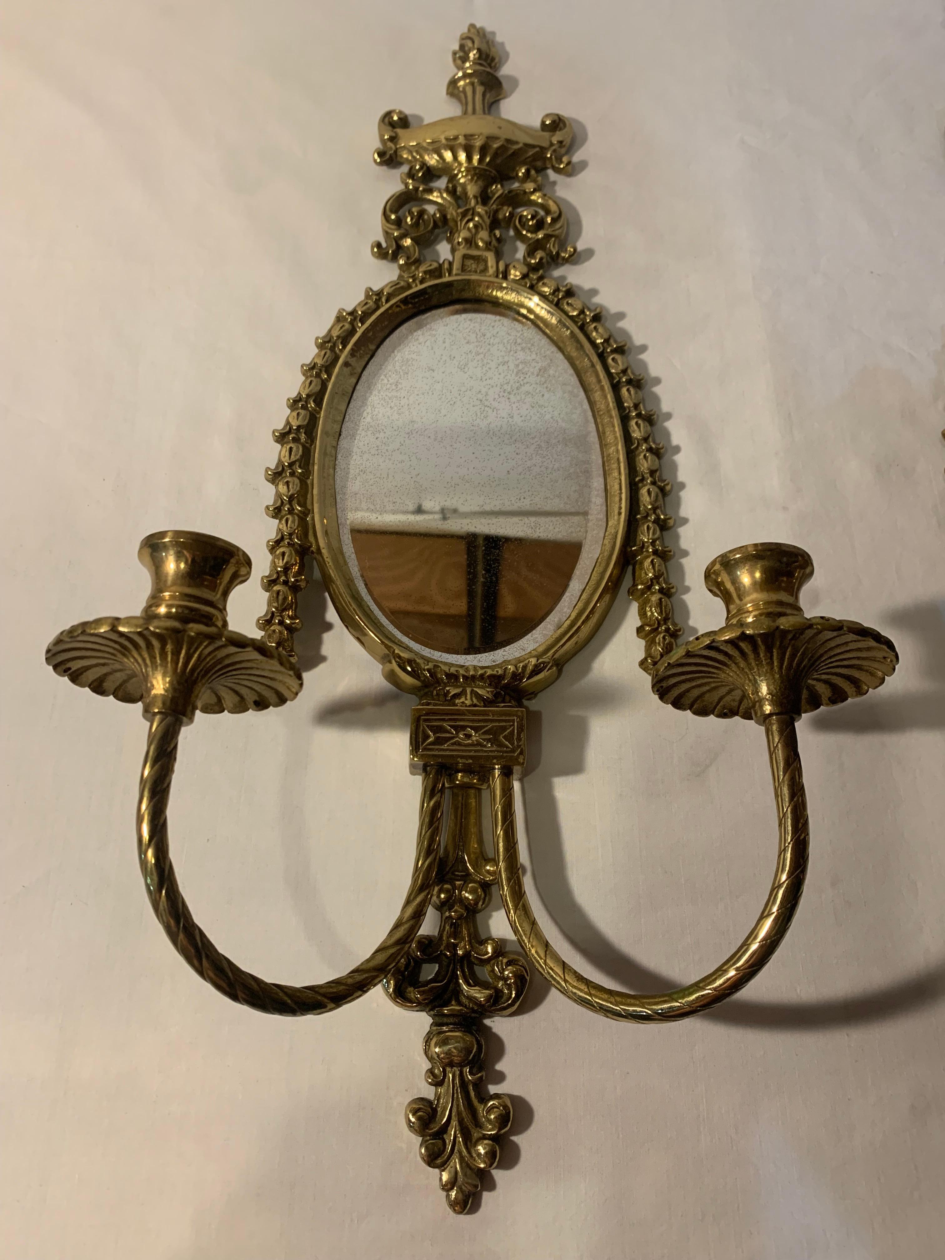 This is for a pair of vintage wall sconce candle holders with beveled mirrors. These are a brass tone metal and marked Glo-Mar Artworks Inc NY on the back. Not sure what the metal composition is but looks like a brass metal. These are 23
