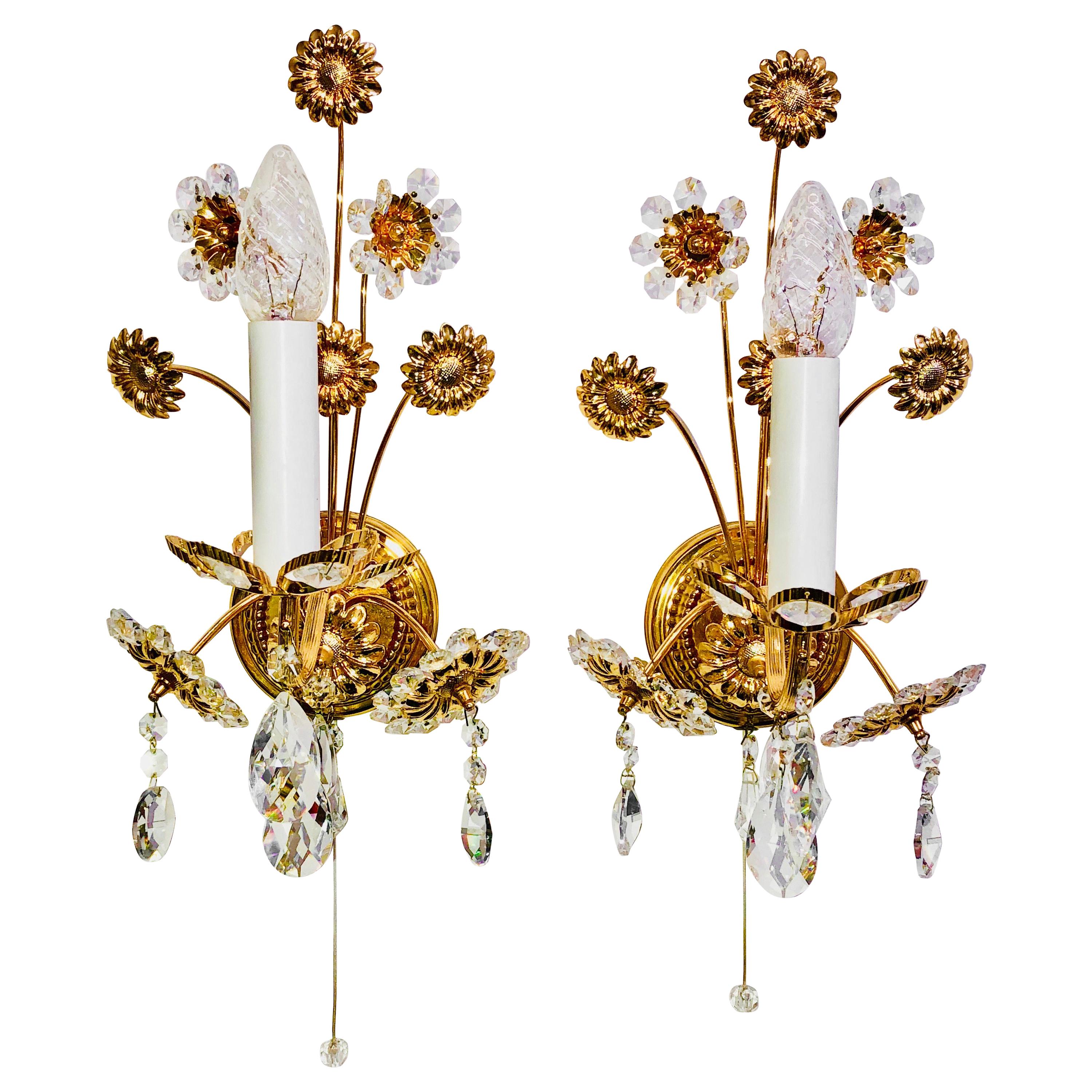Pair of vintage gold-plated sconces with faceted crystal flowers made by the German company Palwa. Each fixture has one European style E14 socket. It requires a European E14 candelabra bulb, up to 40 Watt.